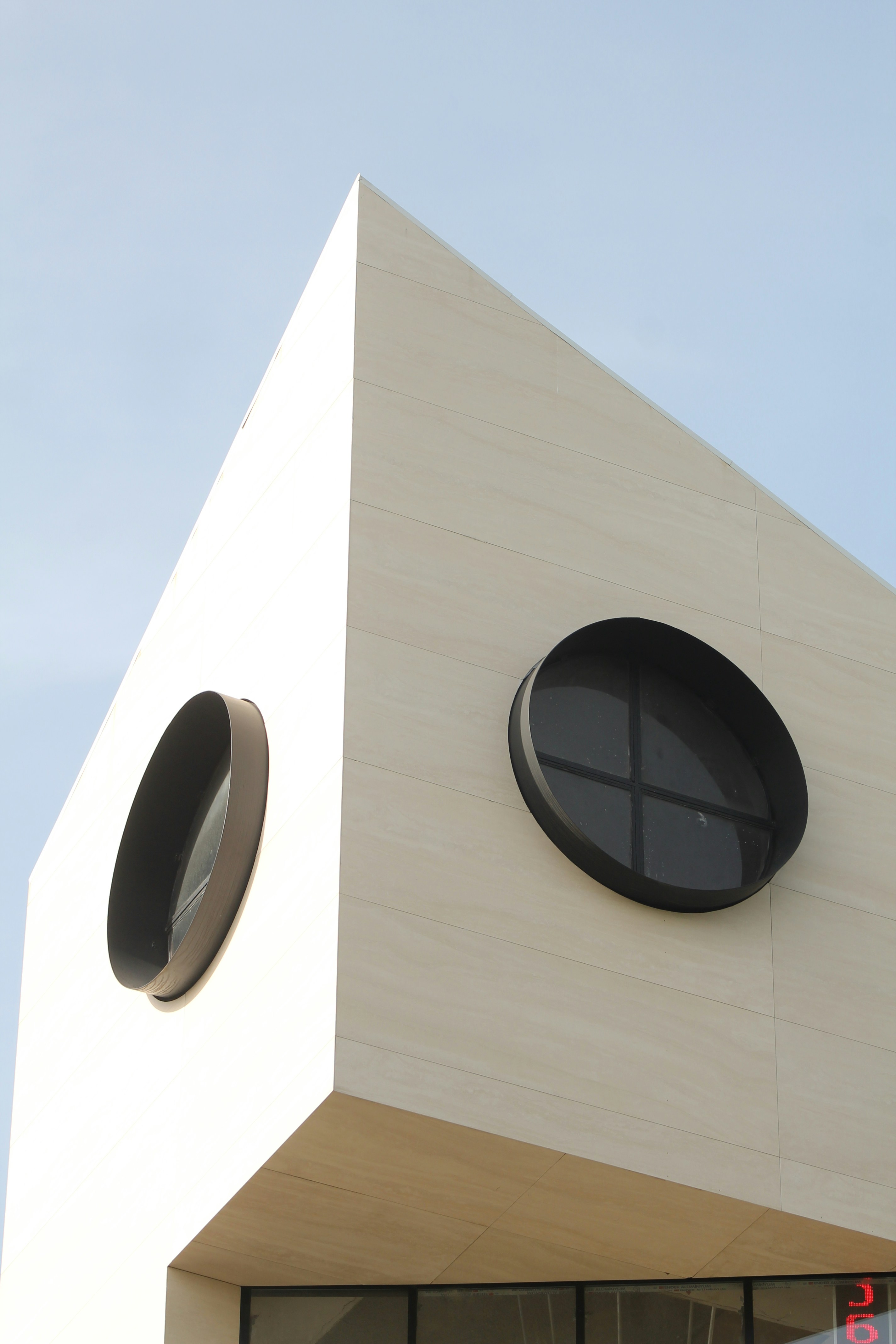 Modern architecture with distinctive circular windows.