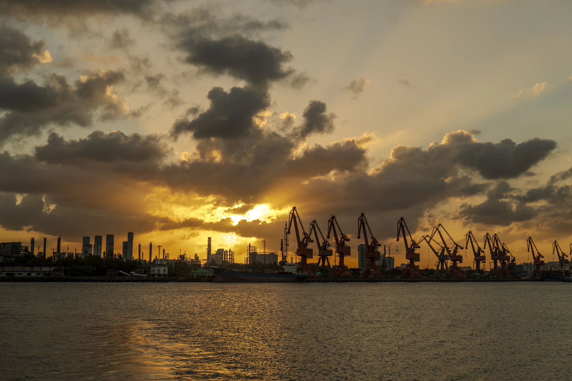 Aerial view of a shipping port at sunset