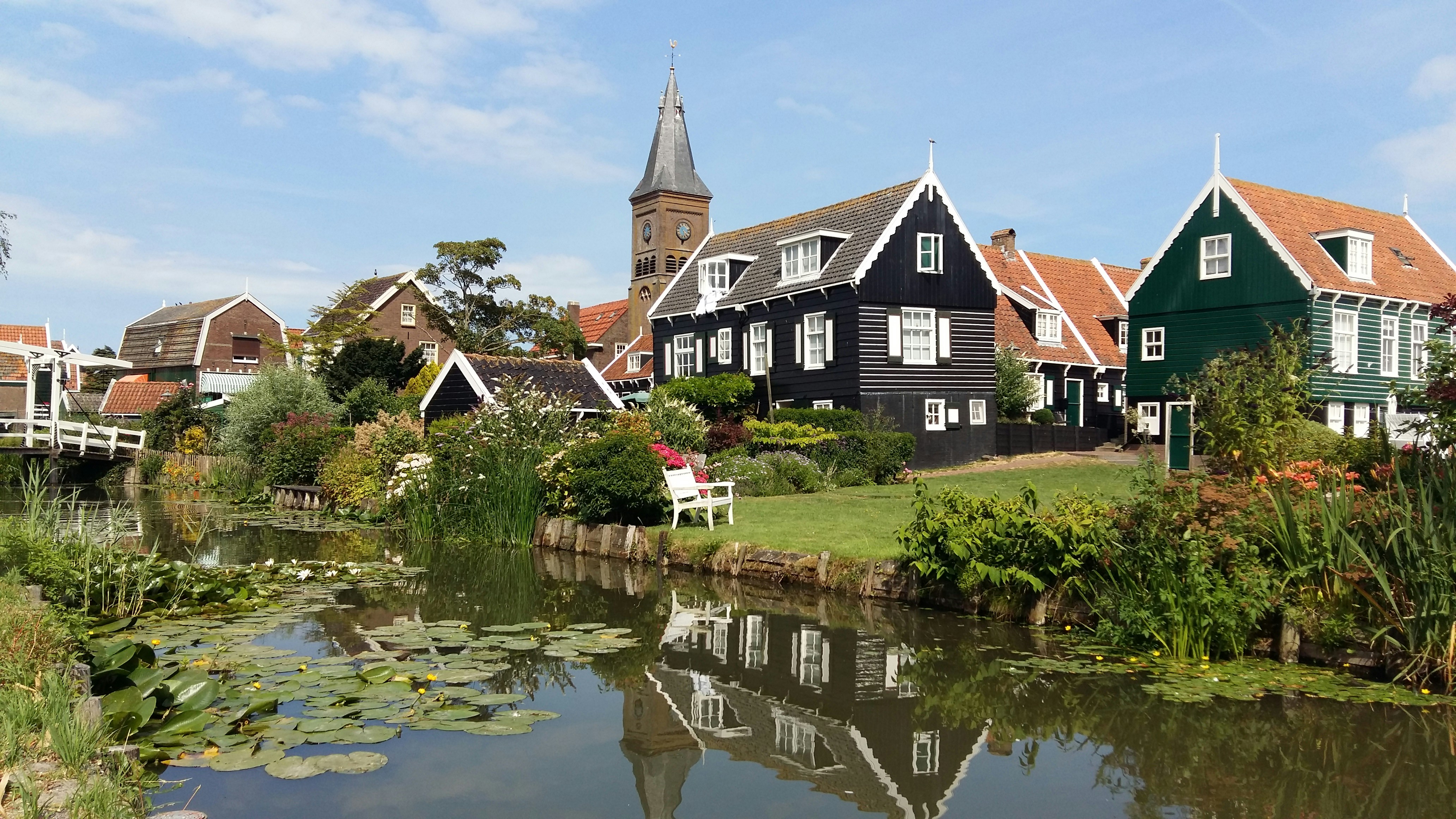 Colorful houses and canals in a charming dutch village.