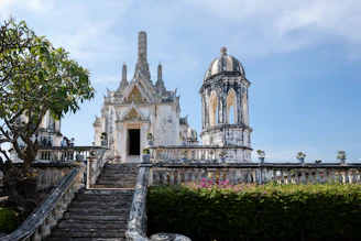 An ornate temple stands tall against a blue sky.