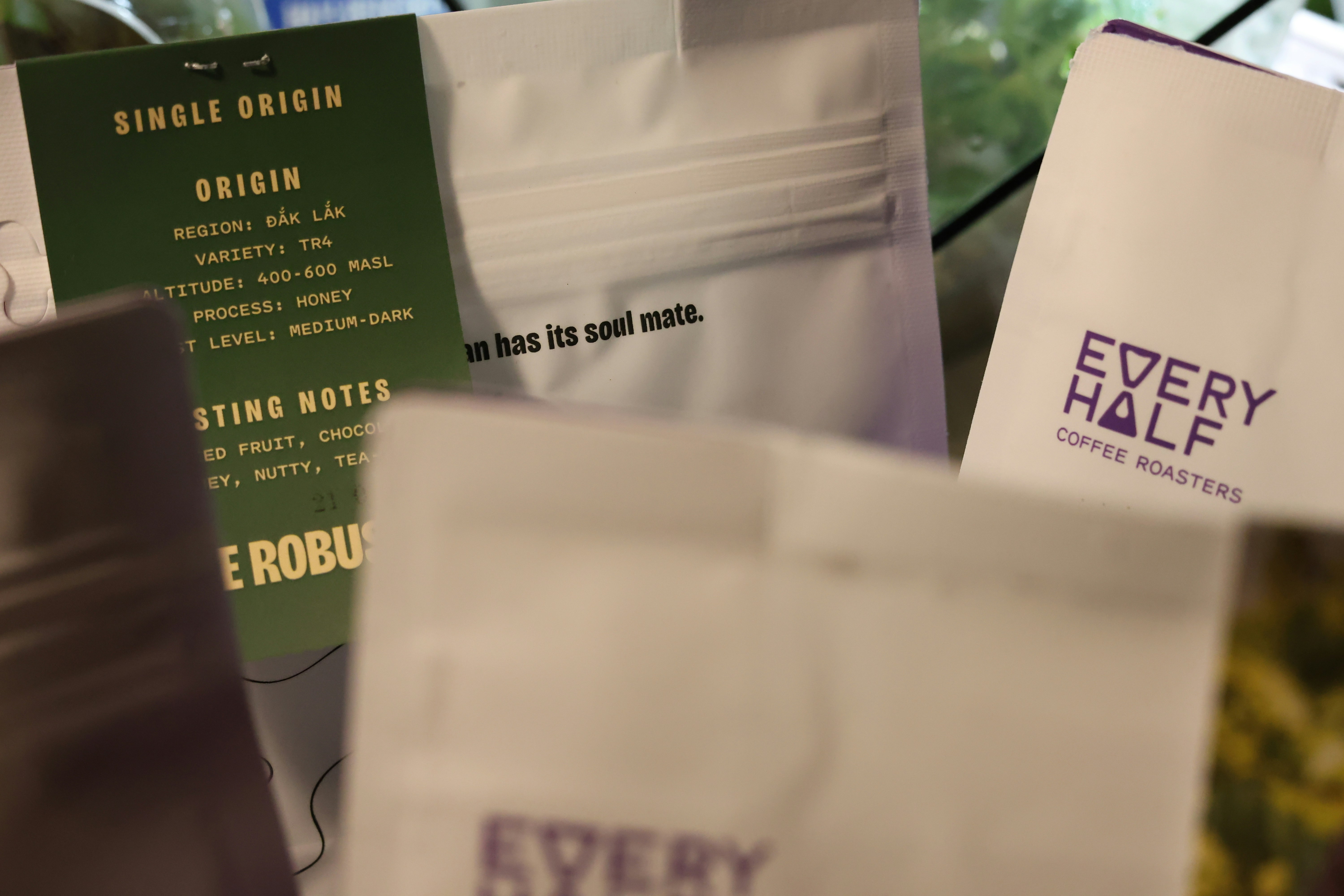 Coffee bags display details of origin and roast.