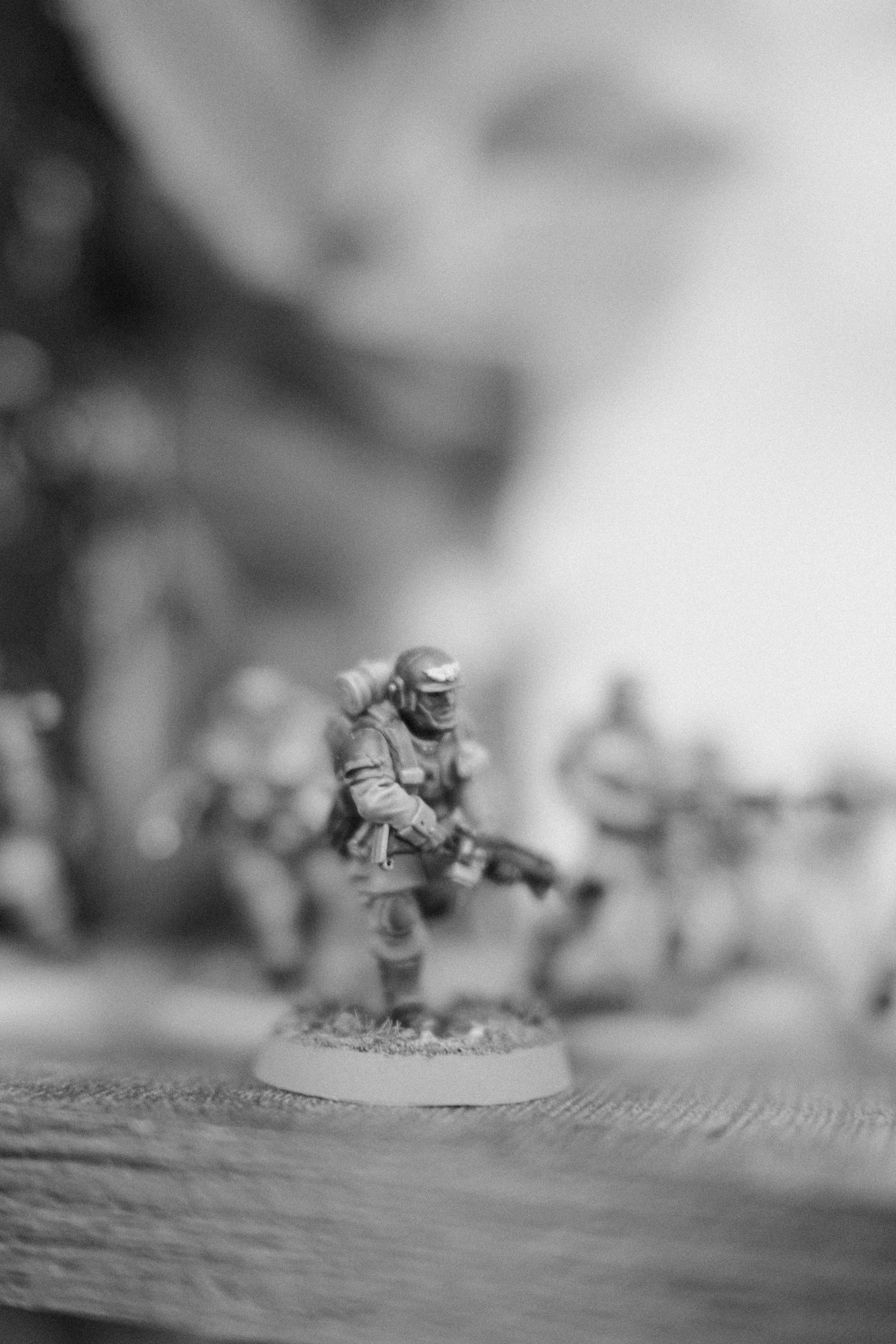 A miniature soldier stands ready with his comrades.