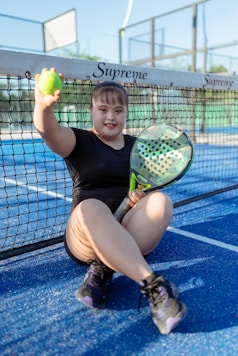 Young woman enjoys playing pickleball.