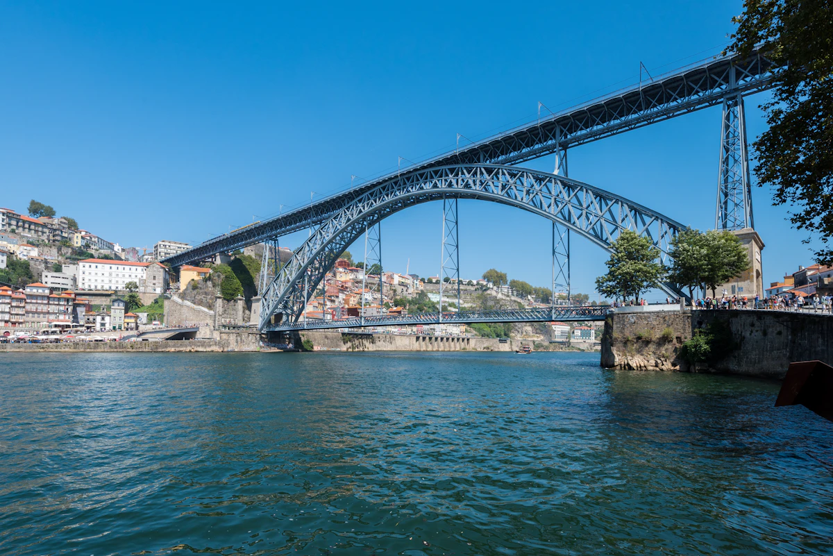 The Dom Luís I Bridge illuminated above the Douro River at night