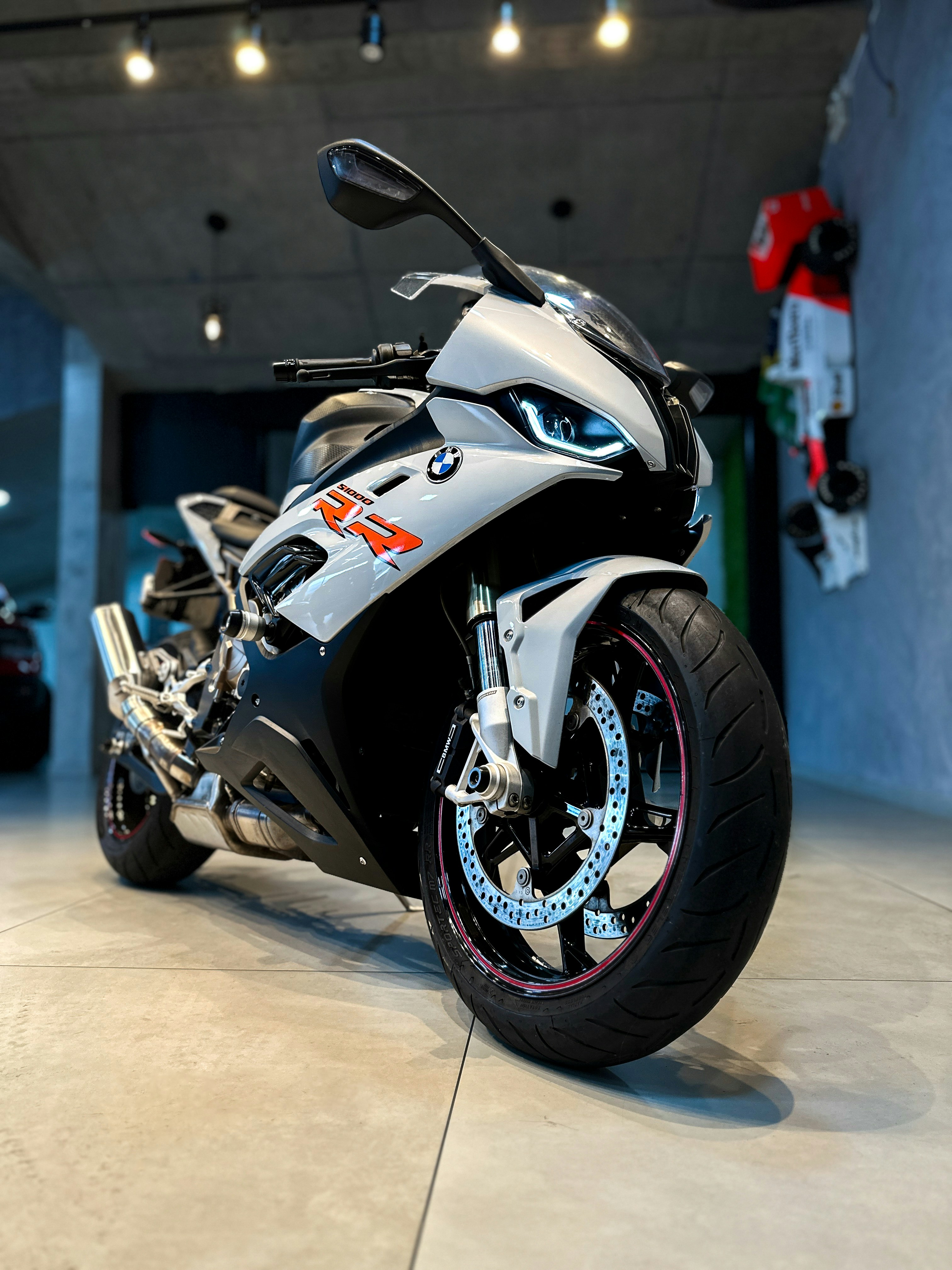A white BMW s1000rr motorcycle is shown.