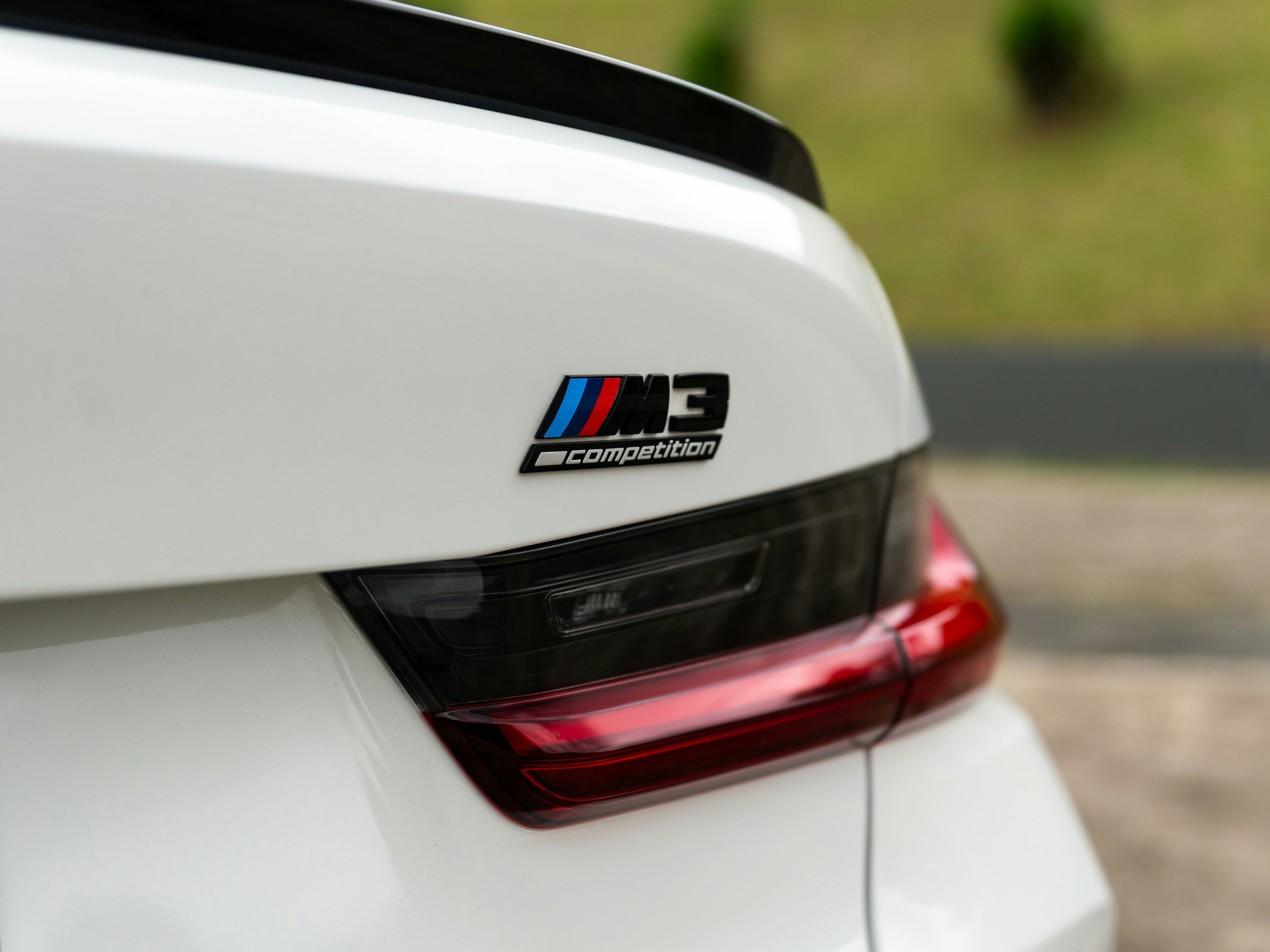 The BMW m3 emblem is shown on the car.