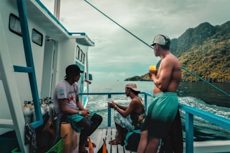 People enjoy a boat ride on a tropical day.