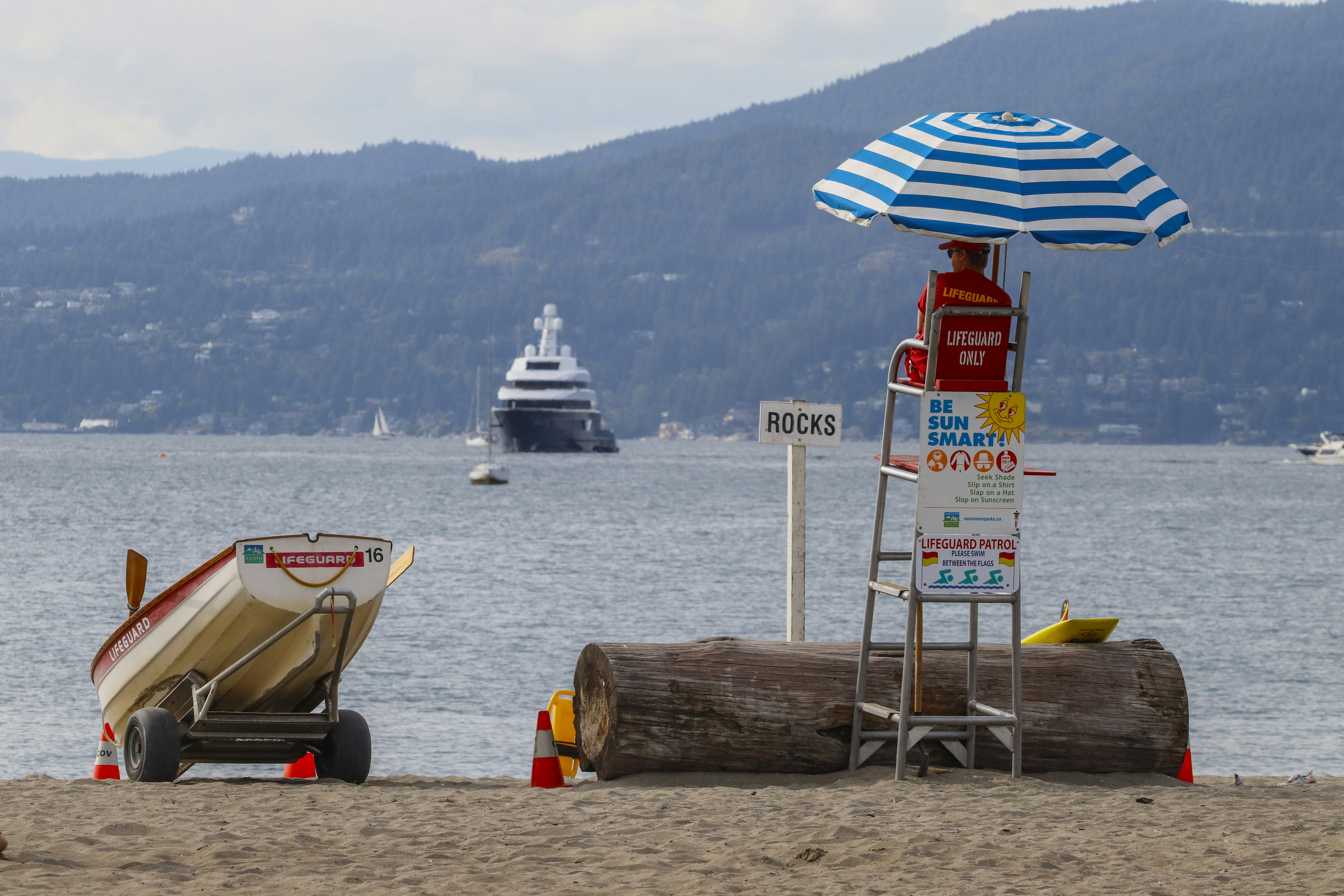 A lifeguard watches the ocean from their stand