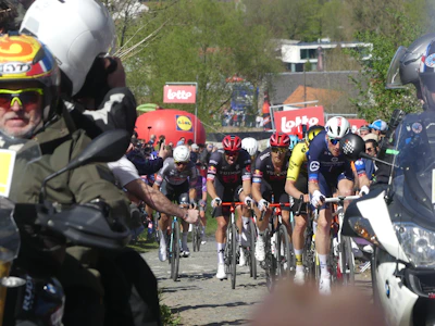 Cyclists race together on a sunny day.