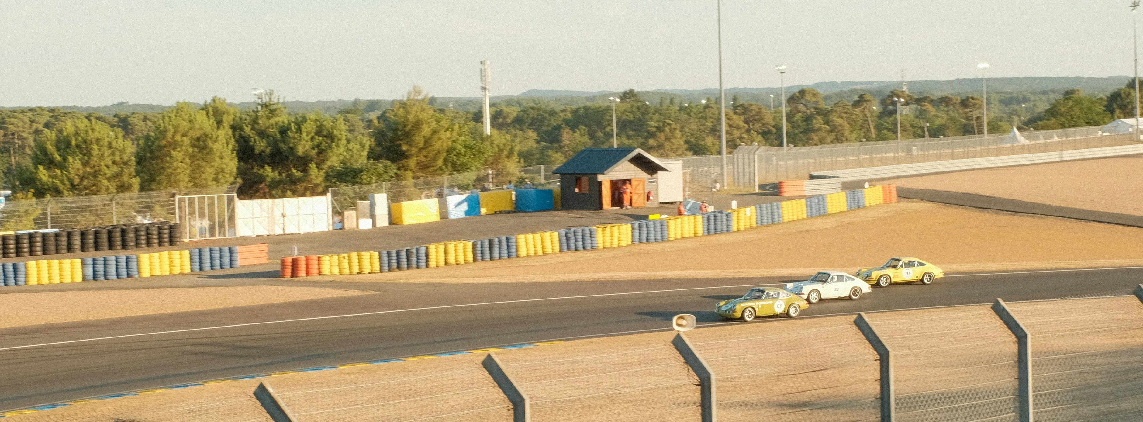 Race cars driving on a racetrack.