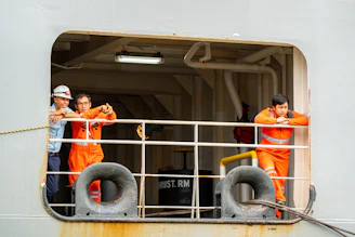 Ship crew members taking a break at the window.