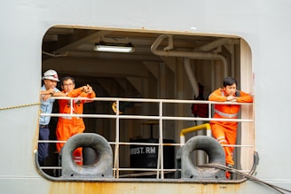 Ship crew members taking a break at the window.