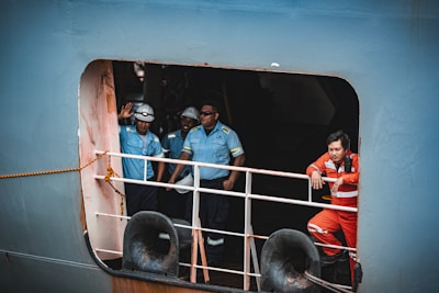 Crew members are onboard a ship.