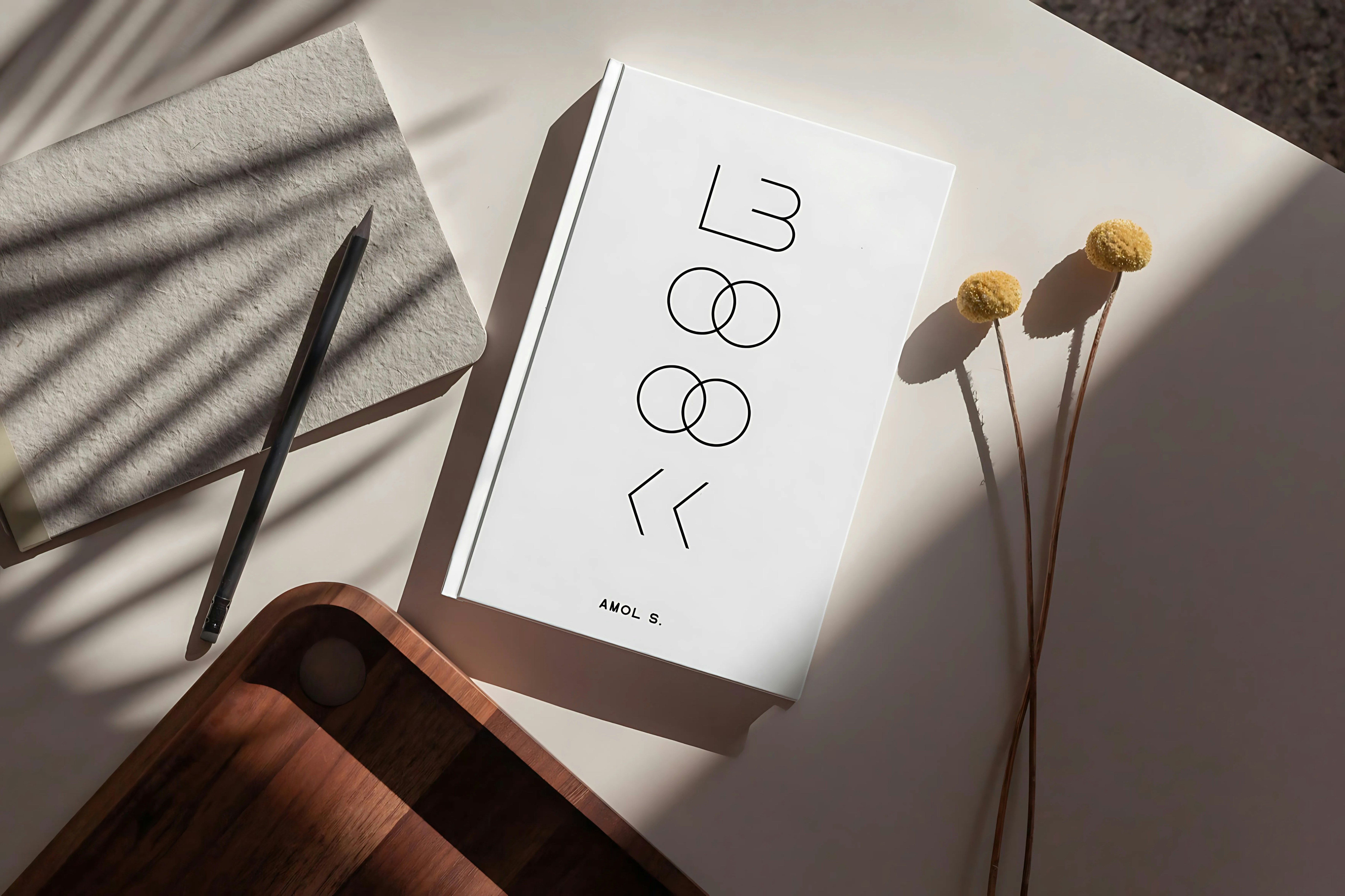 White notebook and dried flowers