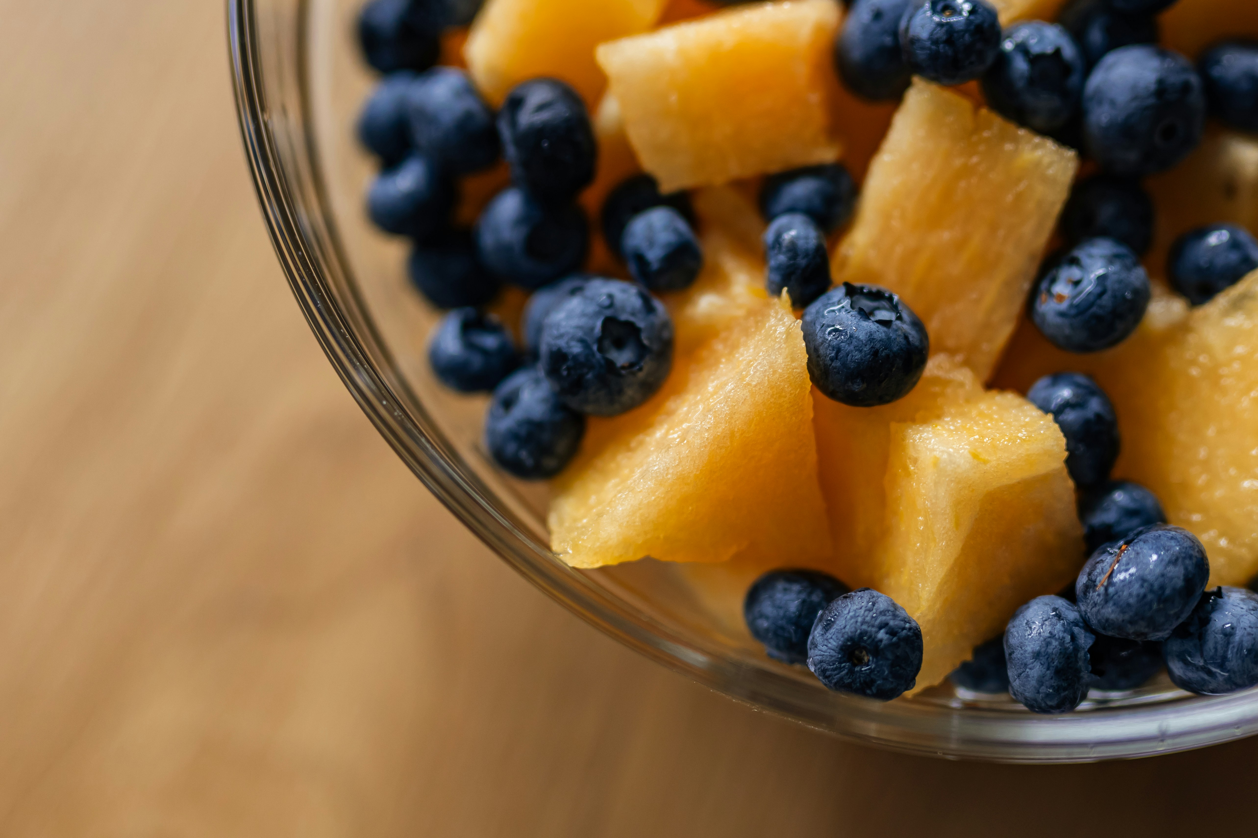 Blueberries and cantaloupe chunks in a bowl.