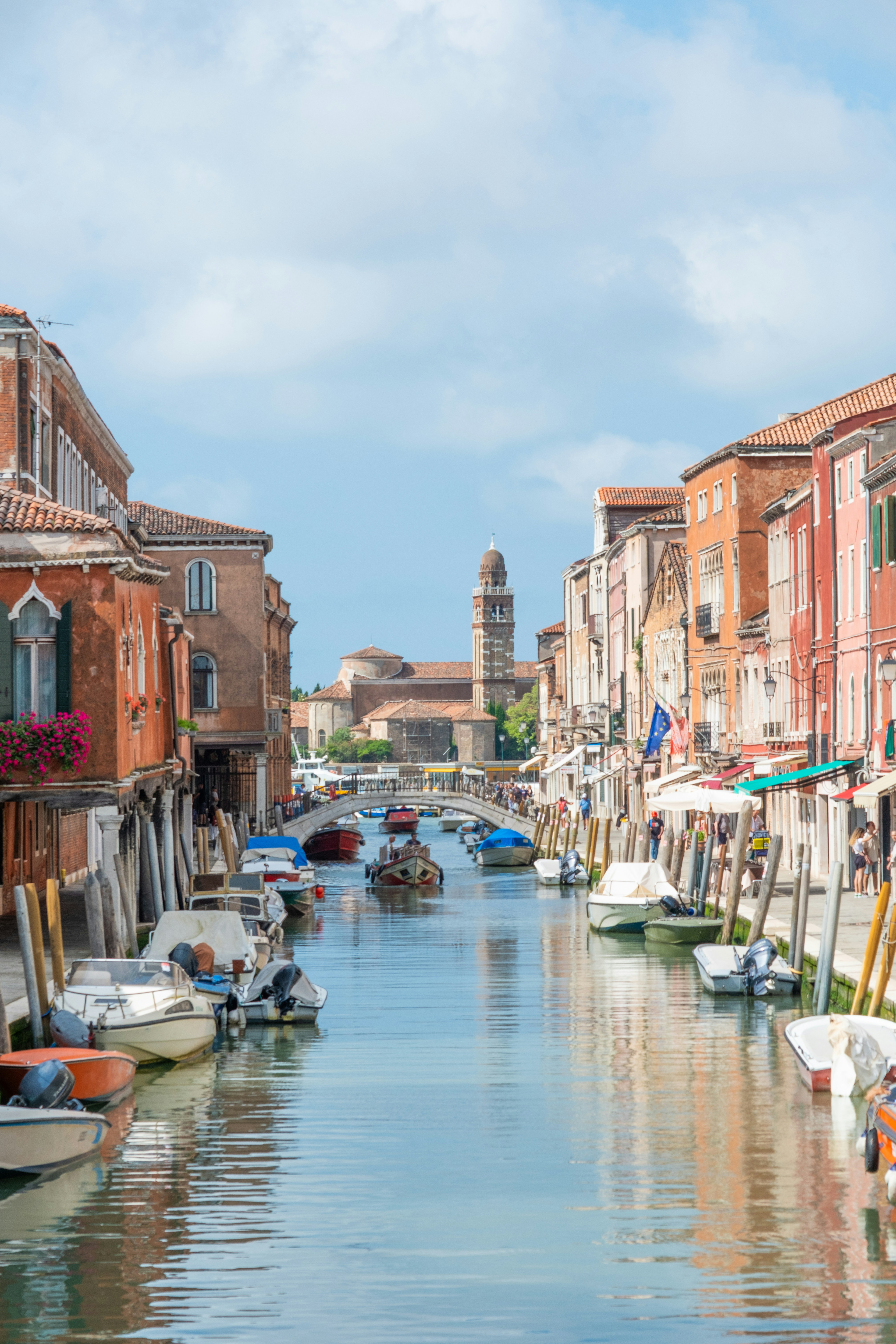 A canal in venice, italy, with boats.