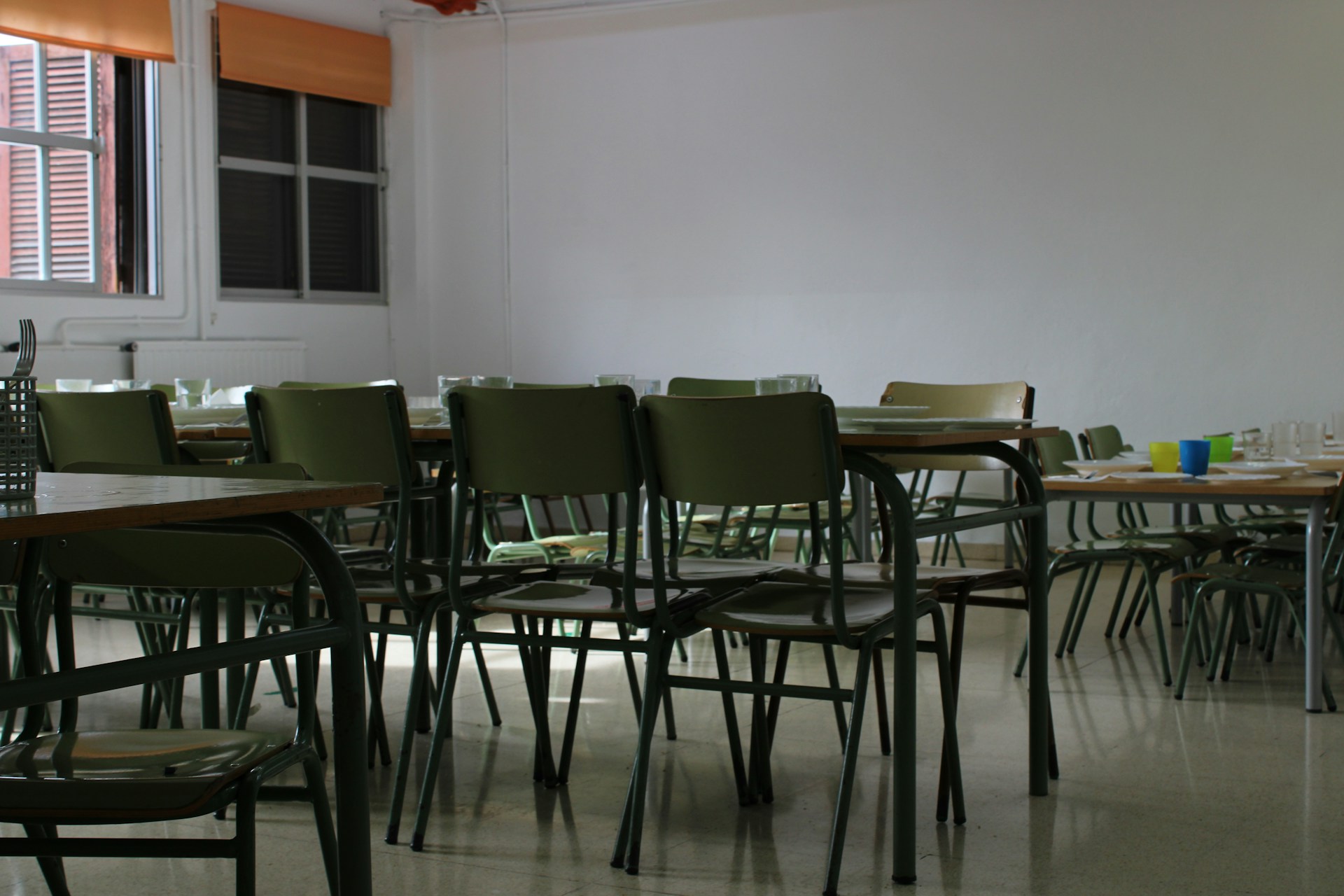 Empty classroom with chairs and tables.