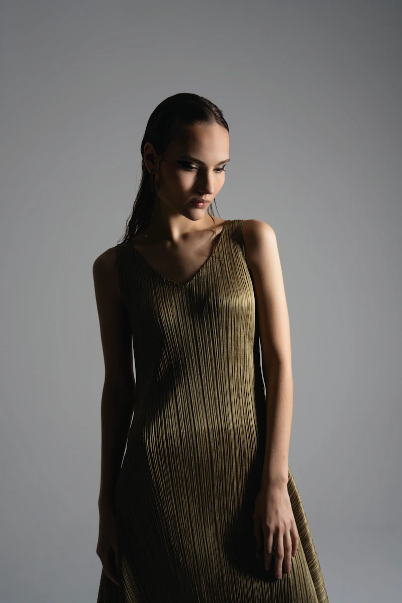 Editorial model wearing a pleated dress