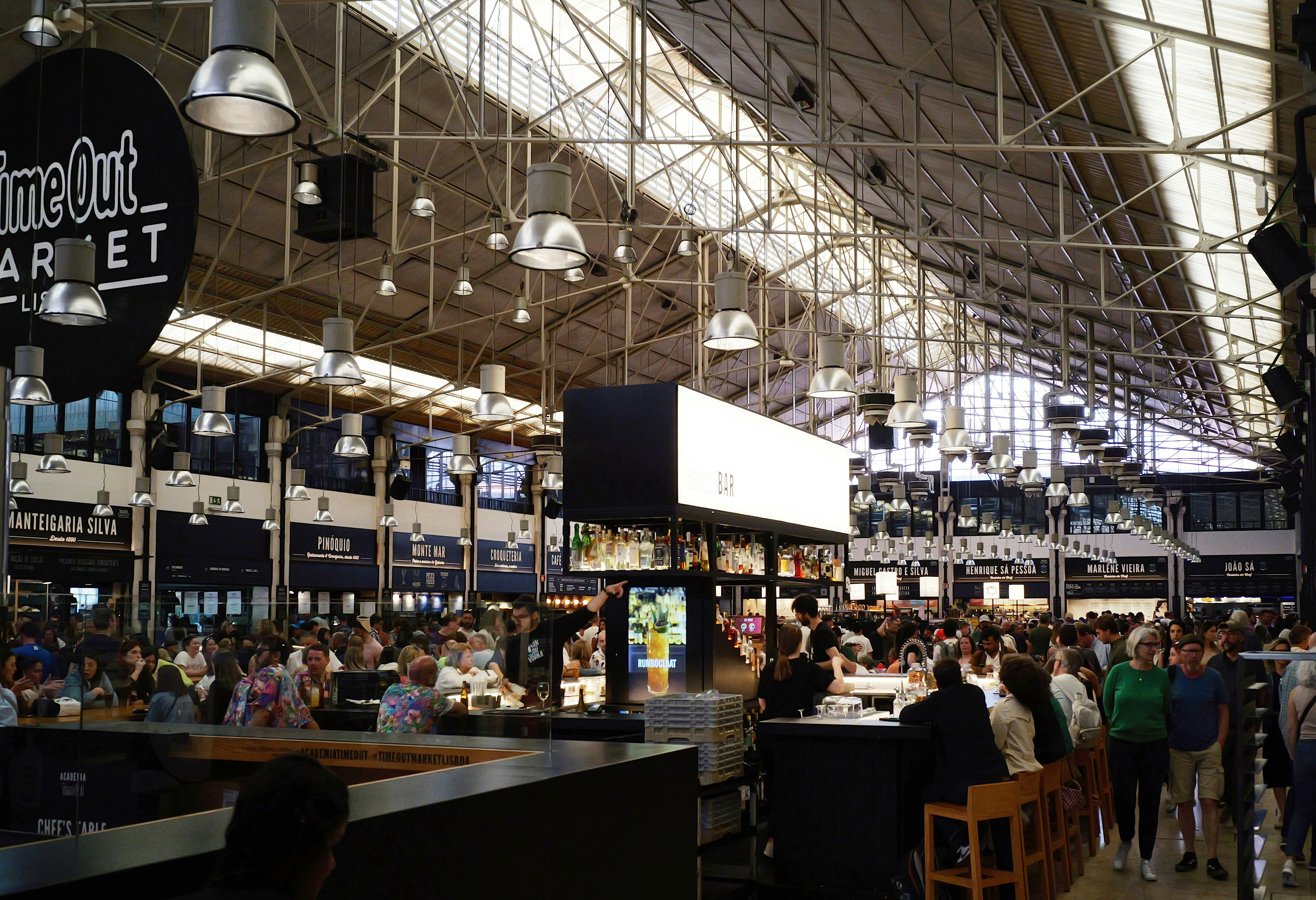 interior of a busy food hall like Chelsea Market - places to eat