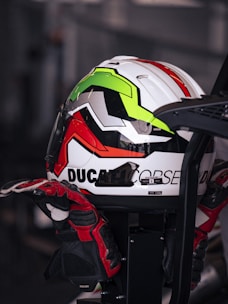 A motorcycle helmet rests on gloves.