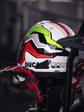 A motorcycle helmet rests on gloves.