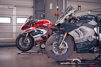Two ducati motorcycles ready for racing.