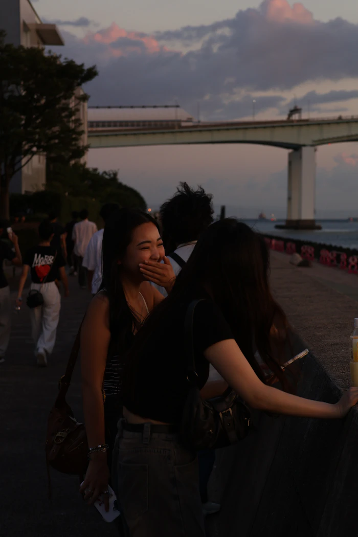 Friends laughing at sunset