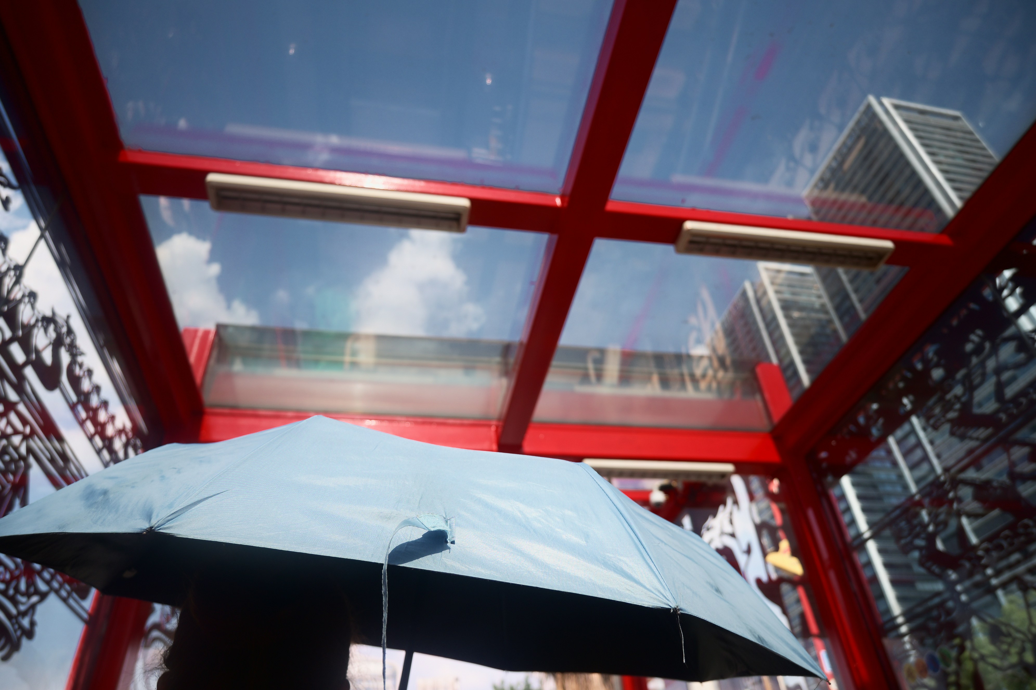 Looking up through glass panels at a city.