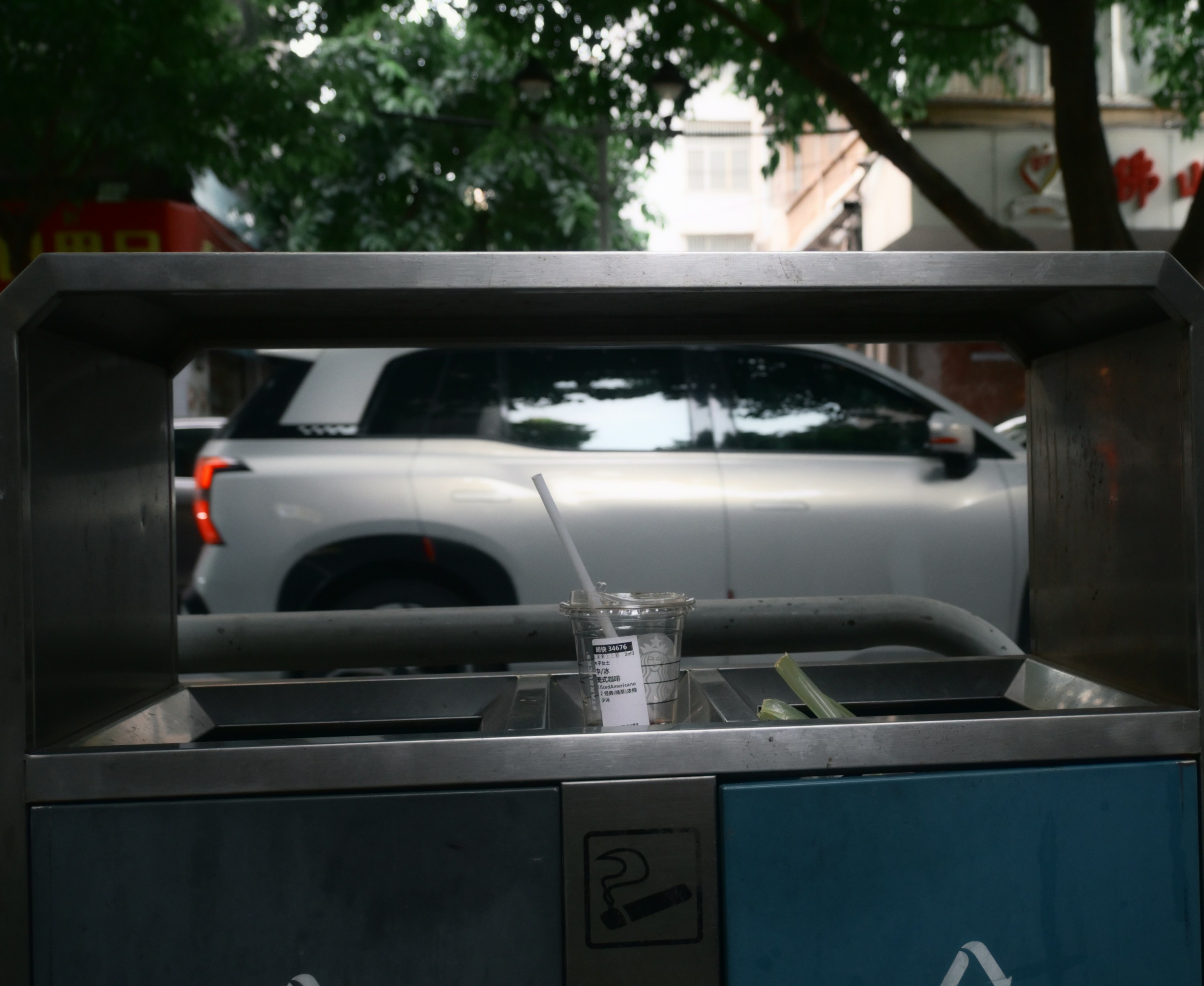 Tesla Cybertruck parked on a city street, highlighting its angular stainless-steel body