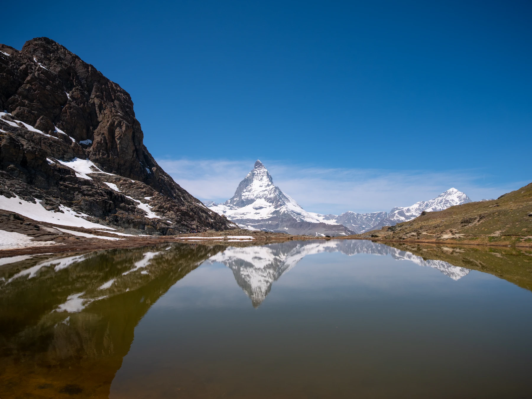The Matterhorn reflected in Riffelsee near Zermatt, Switzerland.
