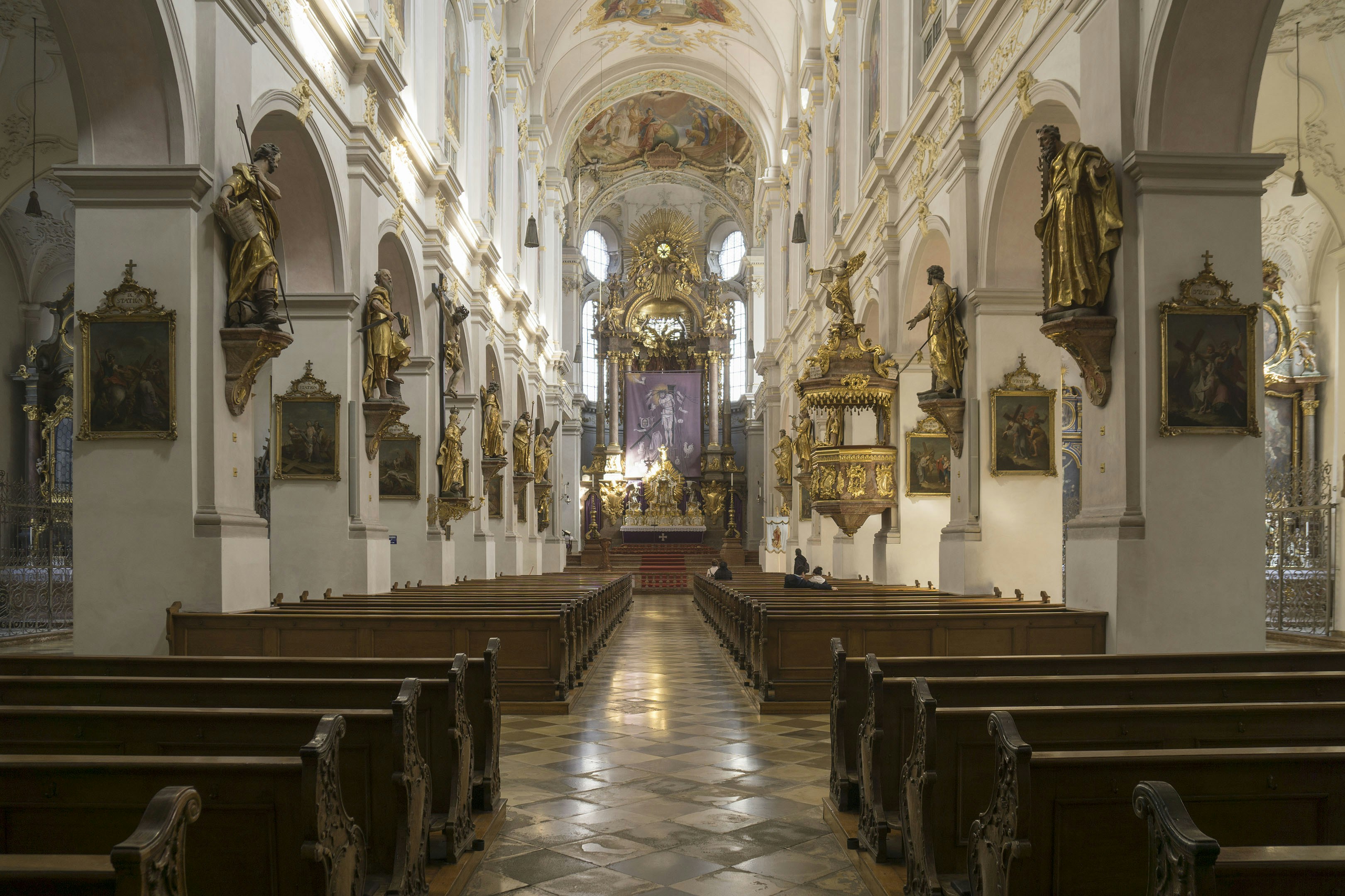 Inside a grand cathedral with ornate decorations.