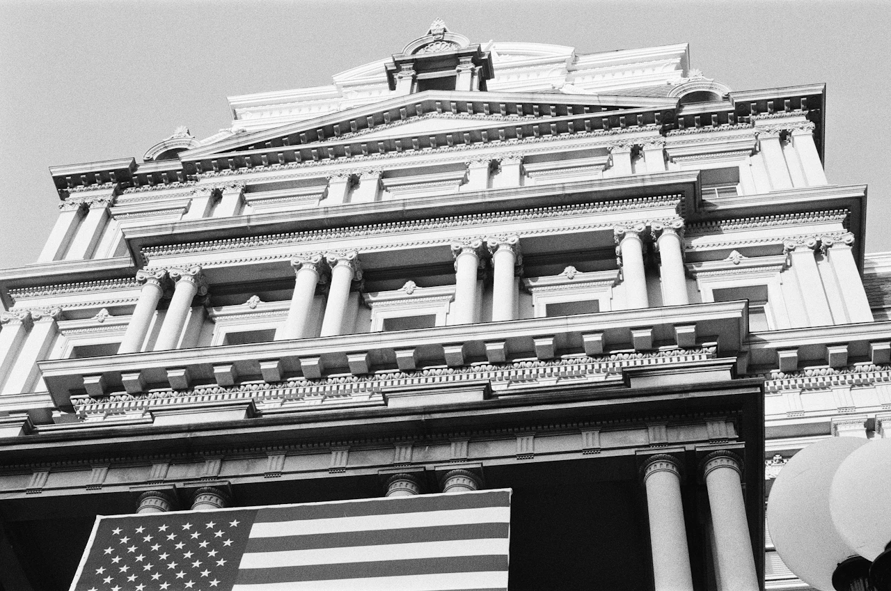 Classical American office building with a US flag