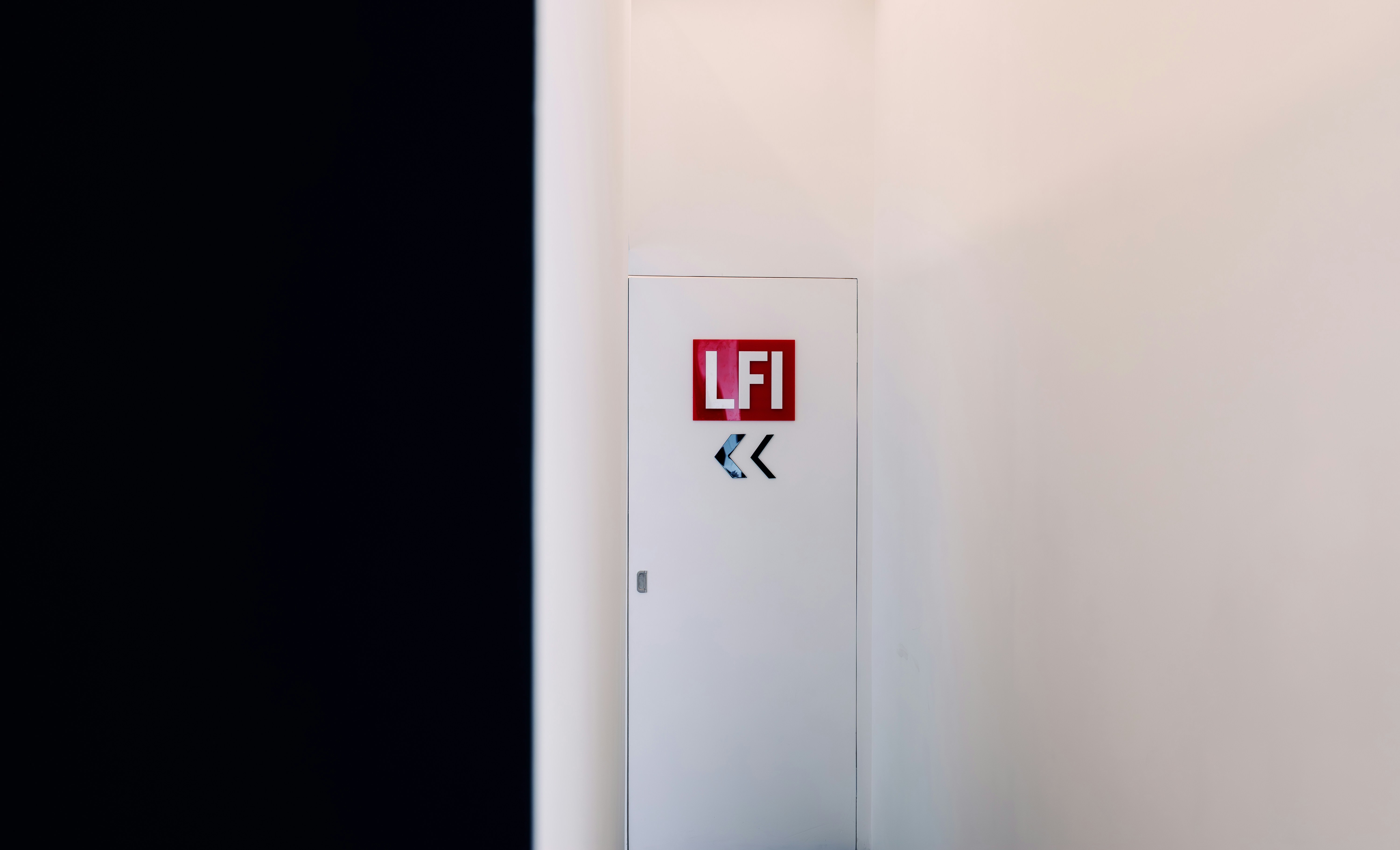 A white cabinet features \