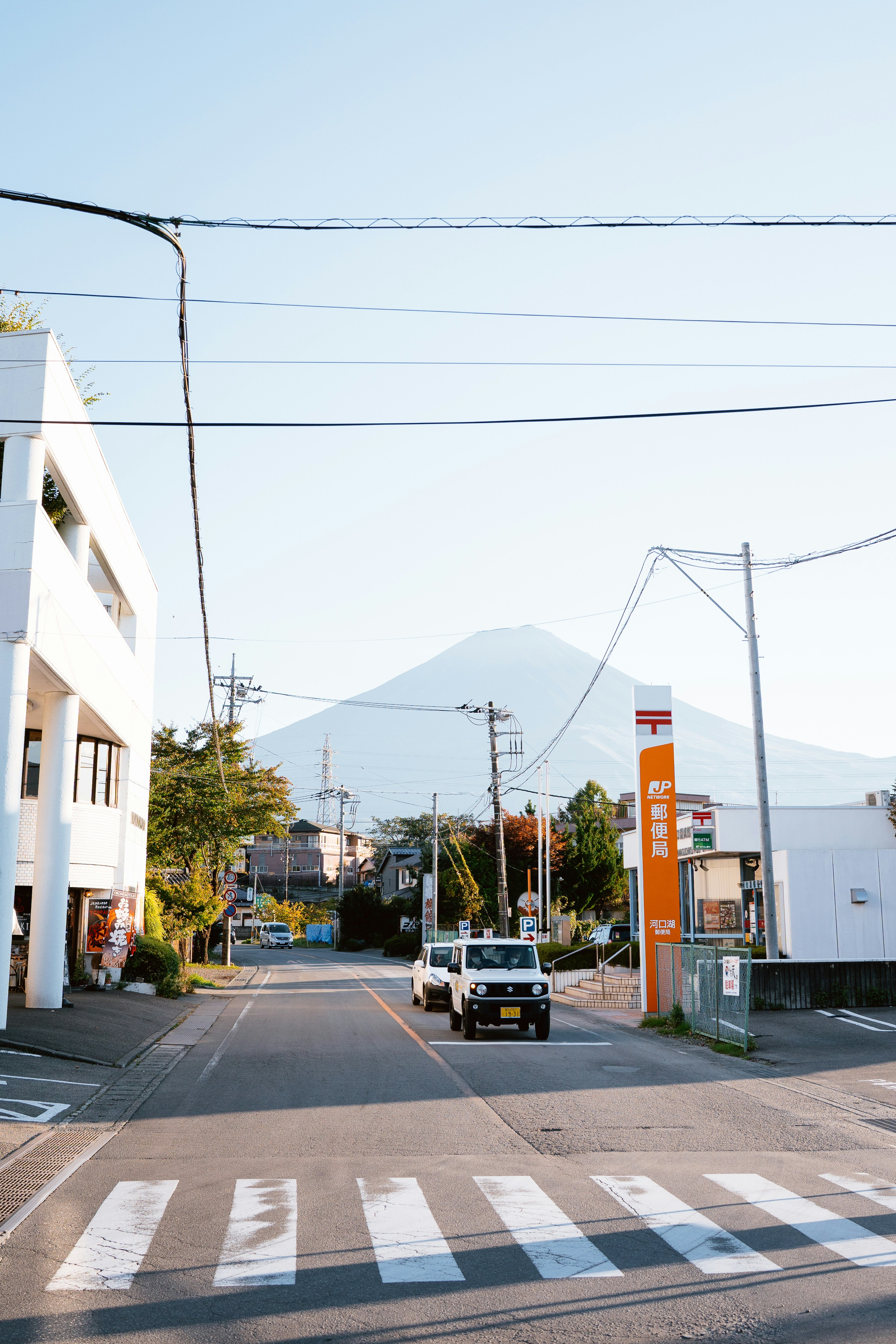 A street with mount fuji in the background.