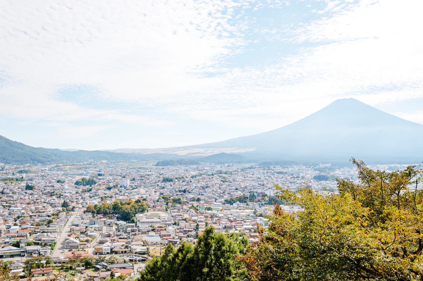 Mount Fuji above the cityscape of Fujiyoshida, Japan