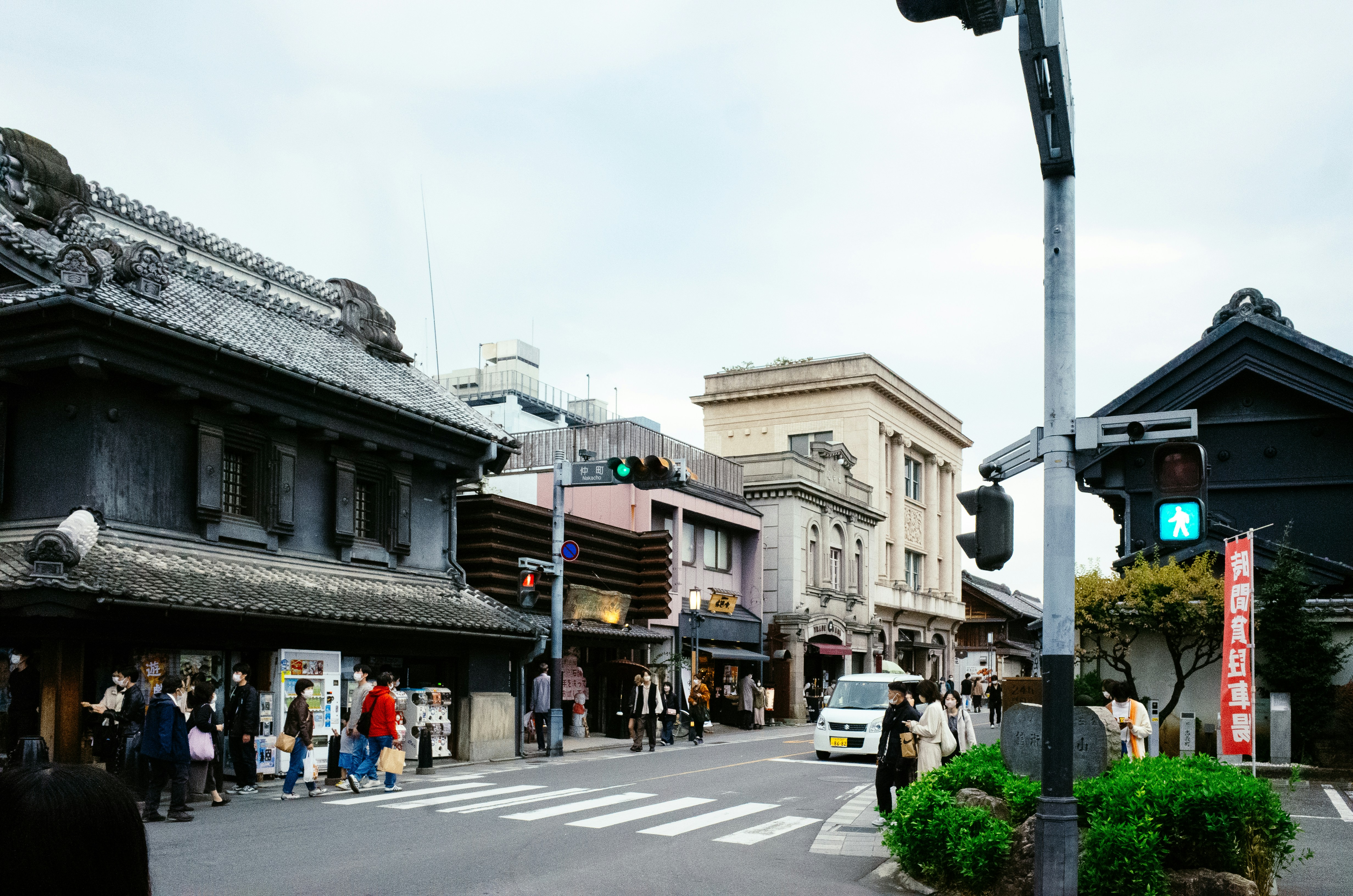 A busy street with traditional japanese architecture.
