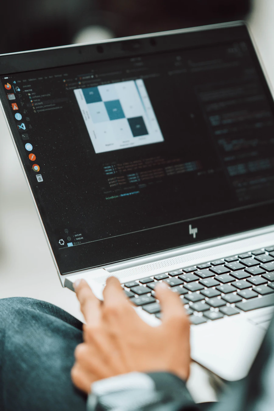 Student focused on coding at laptop — inspired by the spirit of Dragon