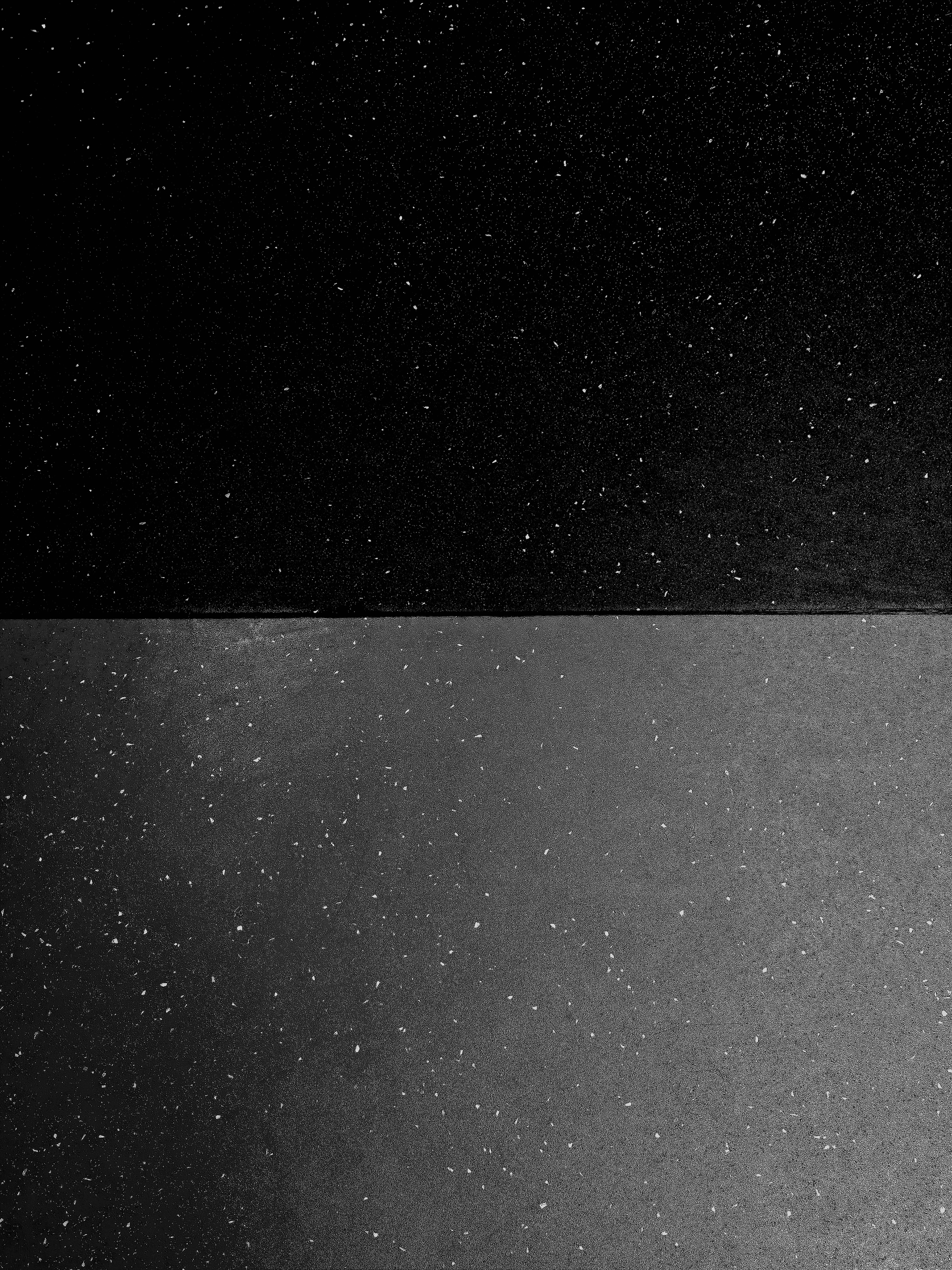 Black and white image with textured surfaces.