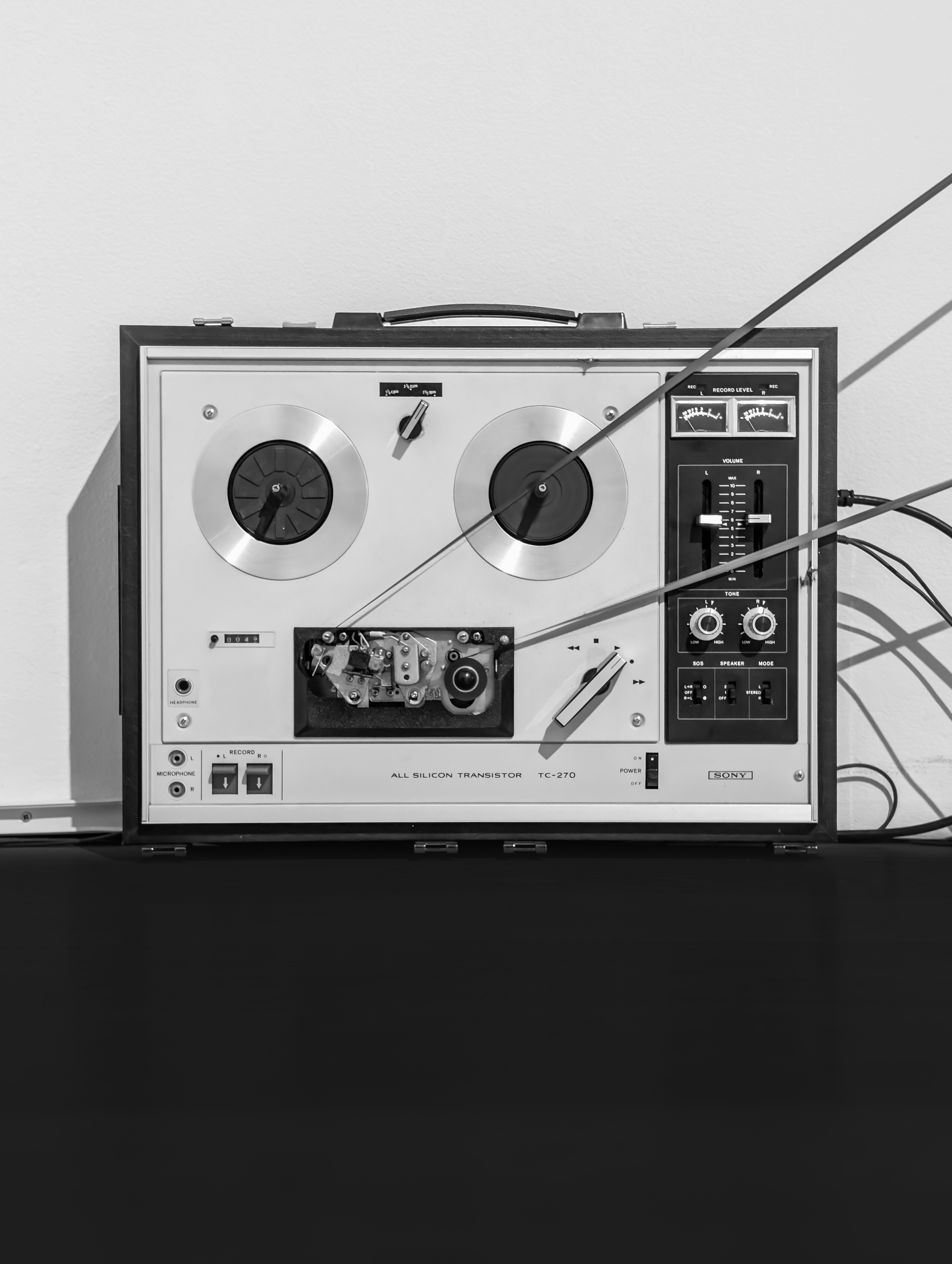 An old reel-to-reel tape recorder is shown.