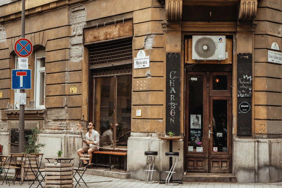 A small Budapest neighbourhood café in a weathered historic corner building