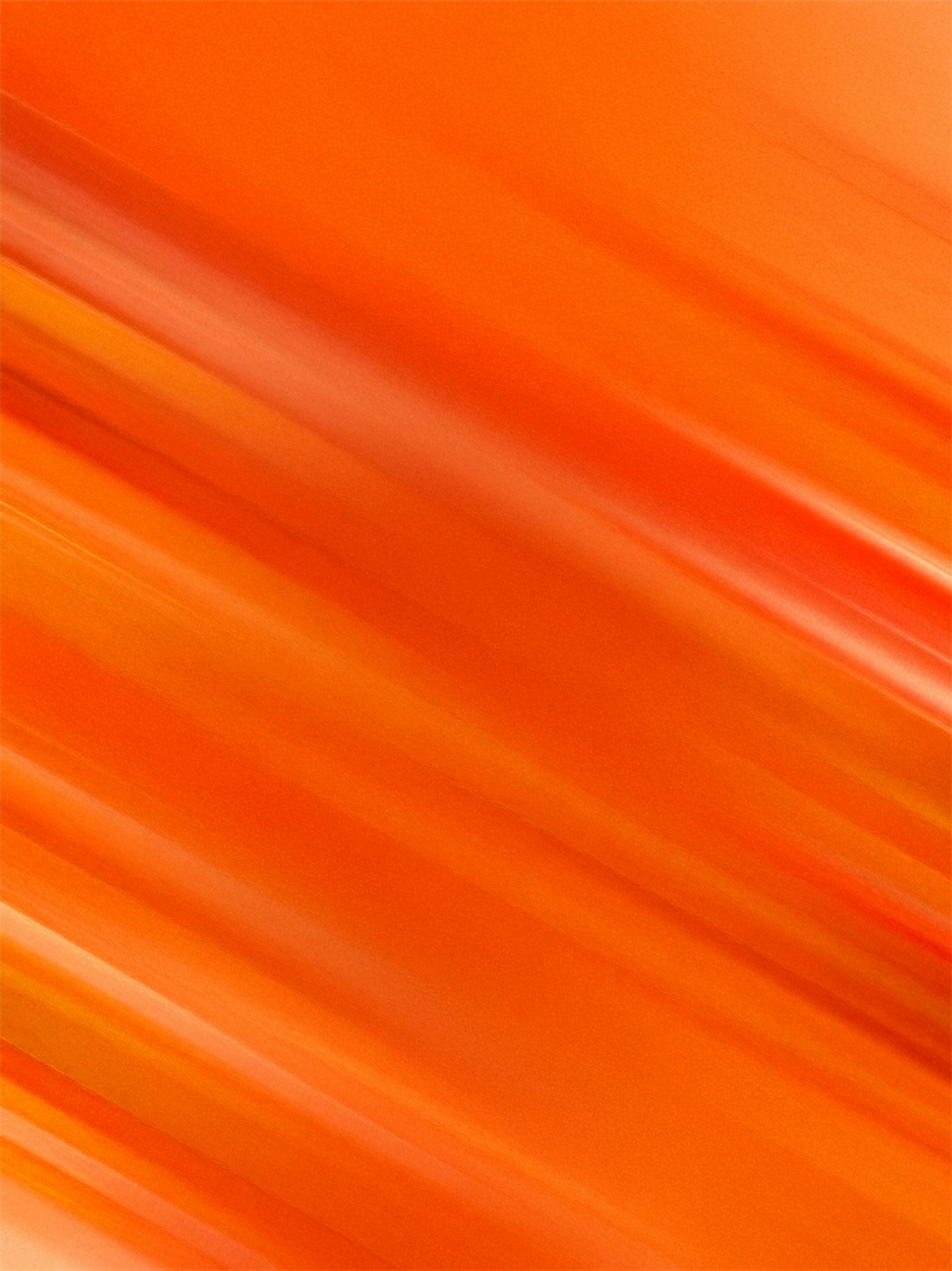 Orange abstract streaks create a dynamic background.