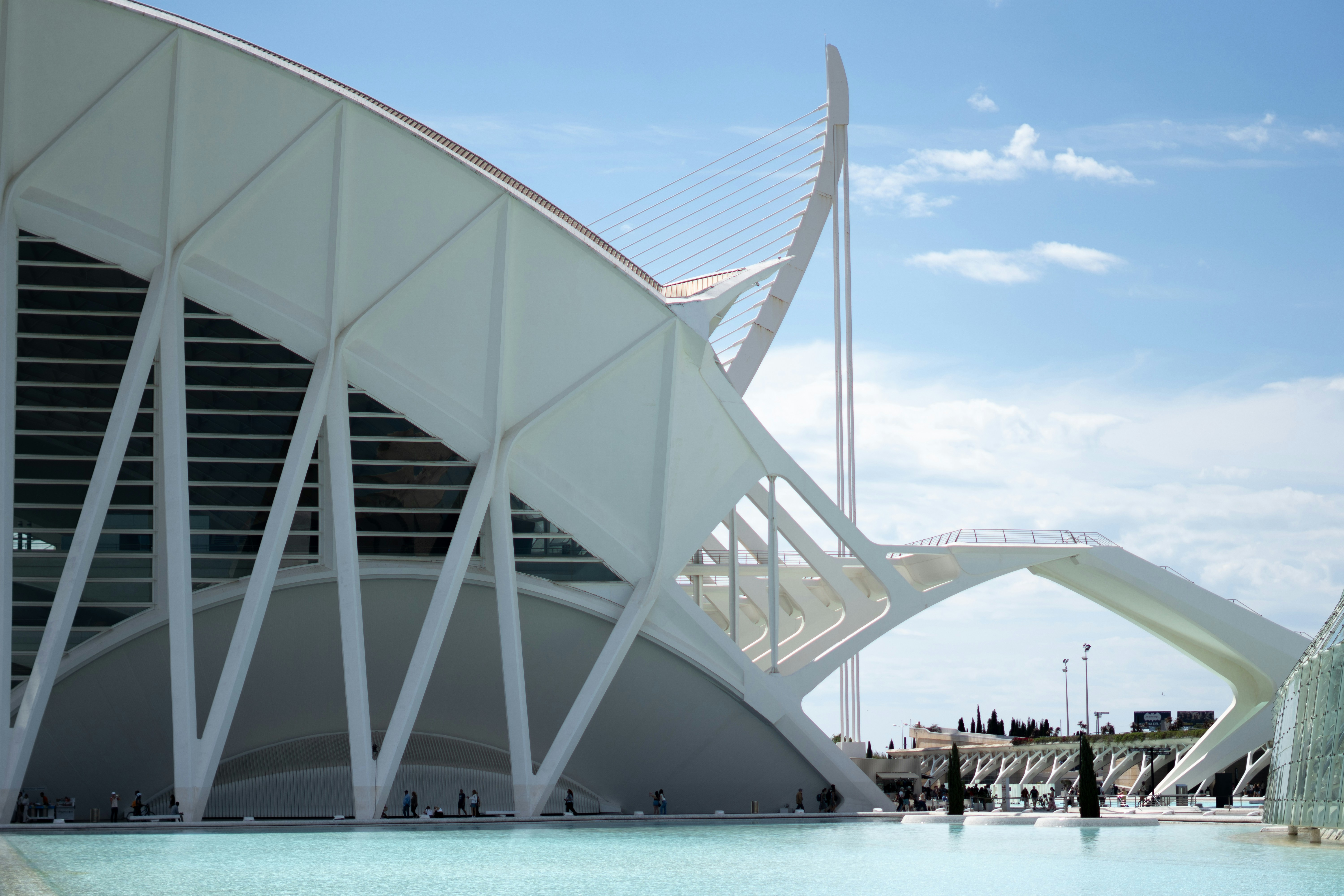 Modern architecture reflects in the calm water.
