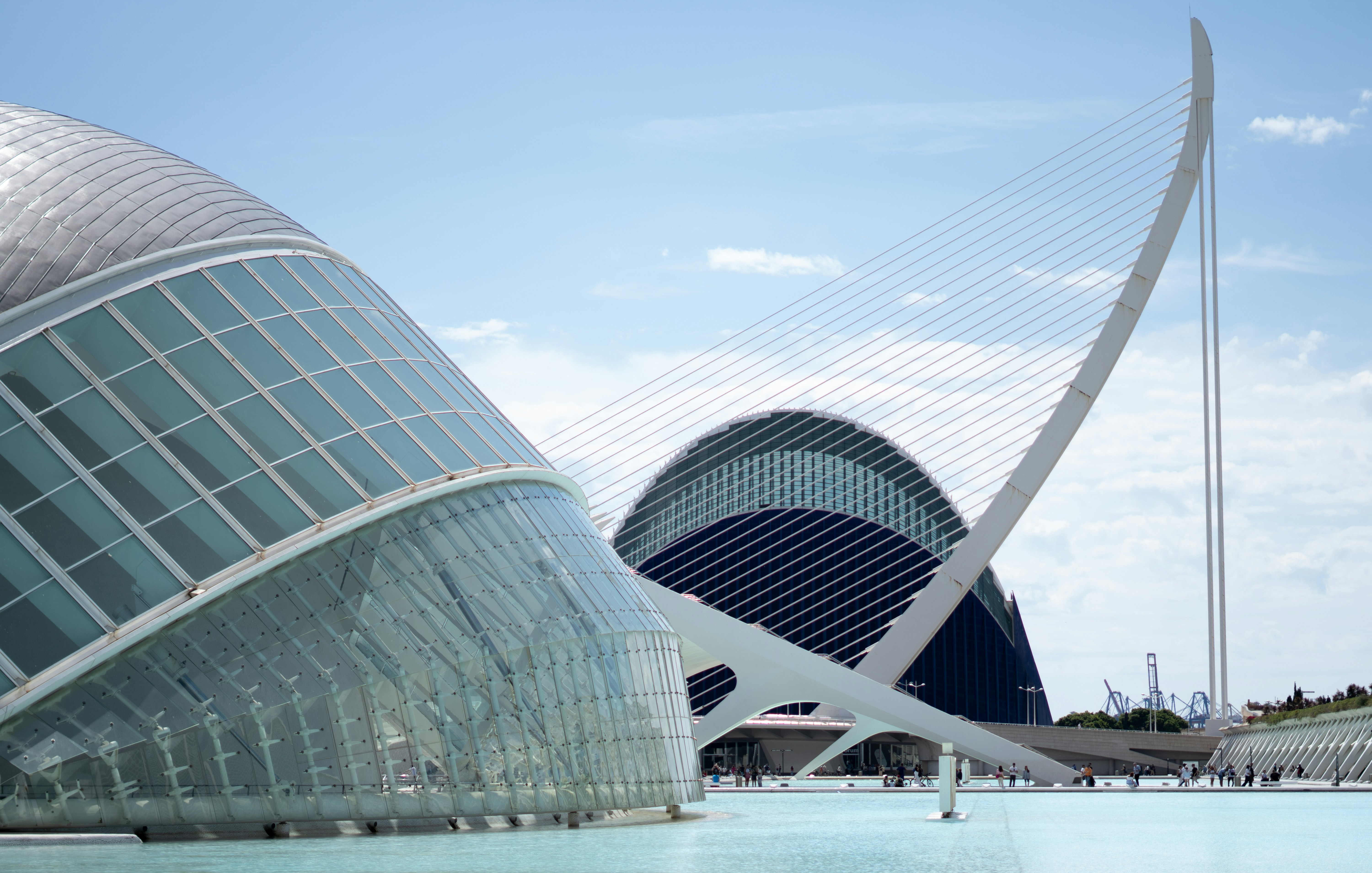 Modern architecture reflects in calm waters.