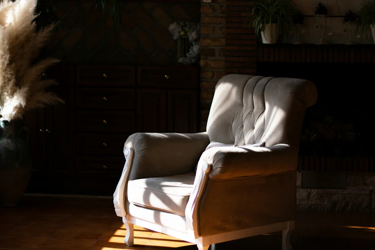 An empty armchair in warm afternoon light