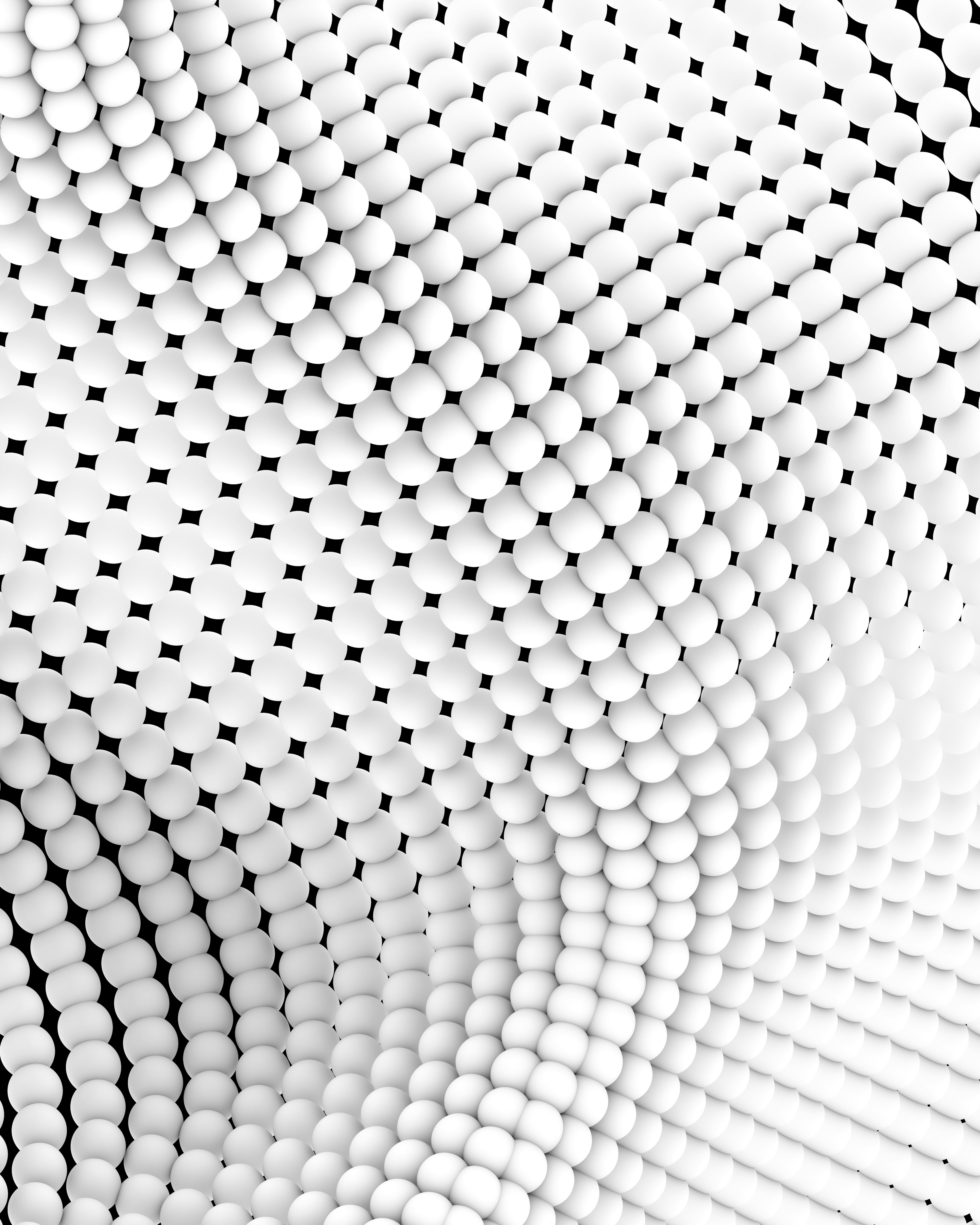 Abstract pattern of white spheres on black.