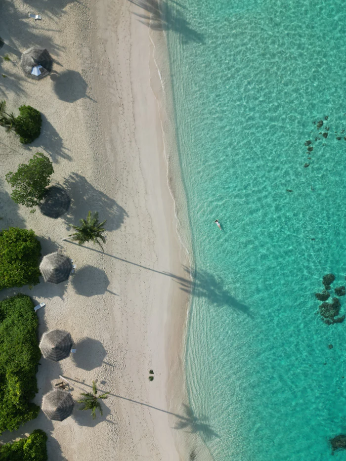 Calm turquoise resort beach with shade, similar to Xanadu Beach in Freeport