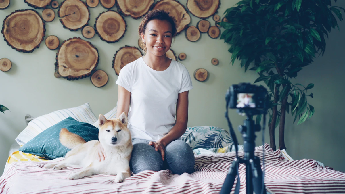 Pet owner with a dog and camera equipment inside a home