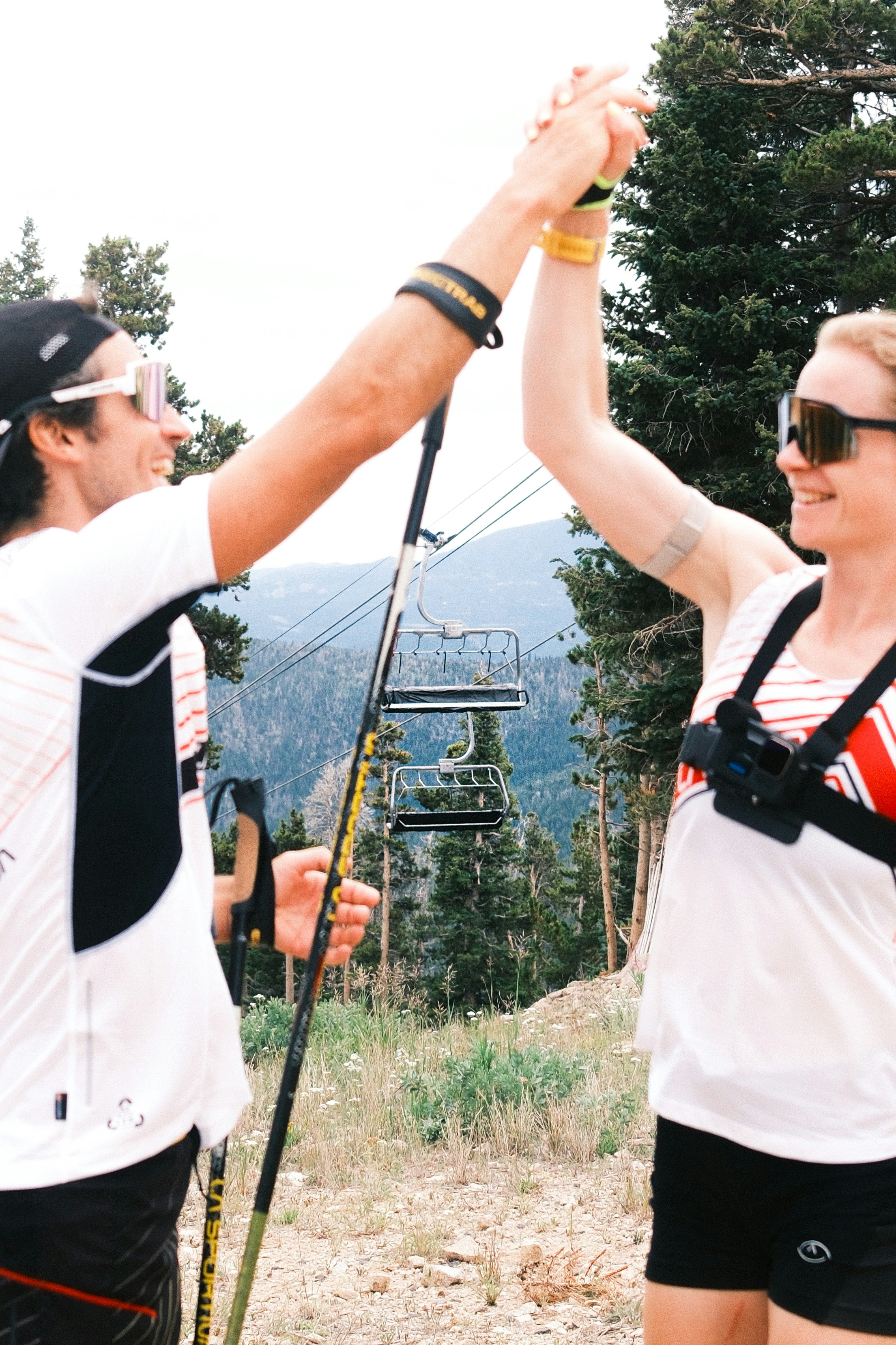 Two athletes celebrate their victory with a high five.