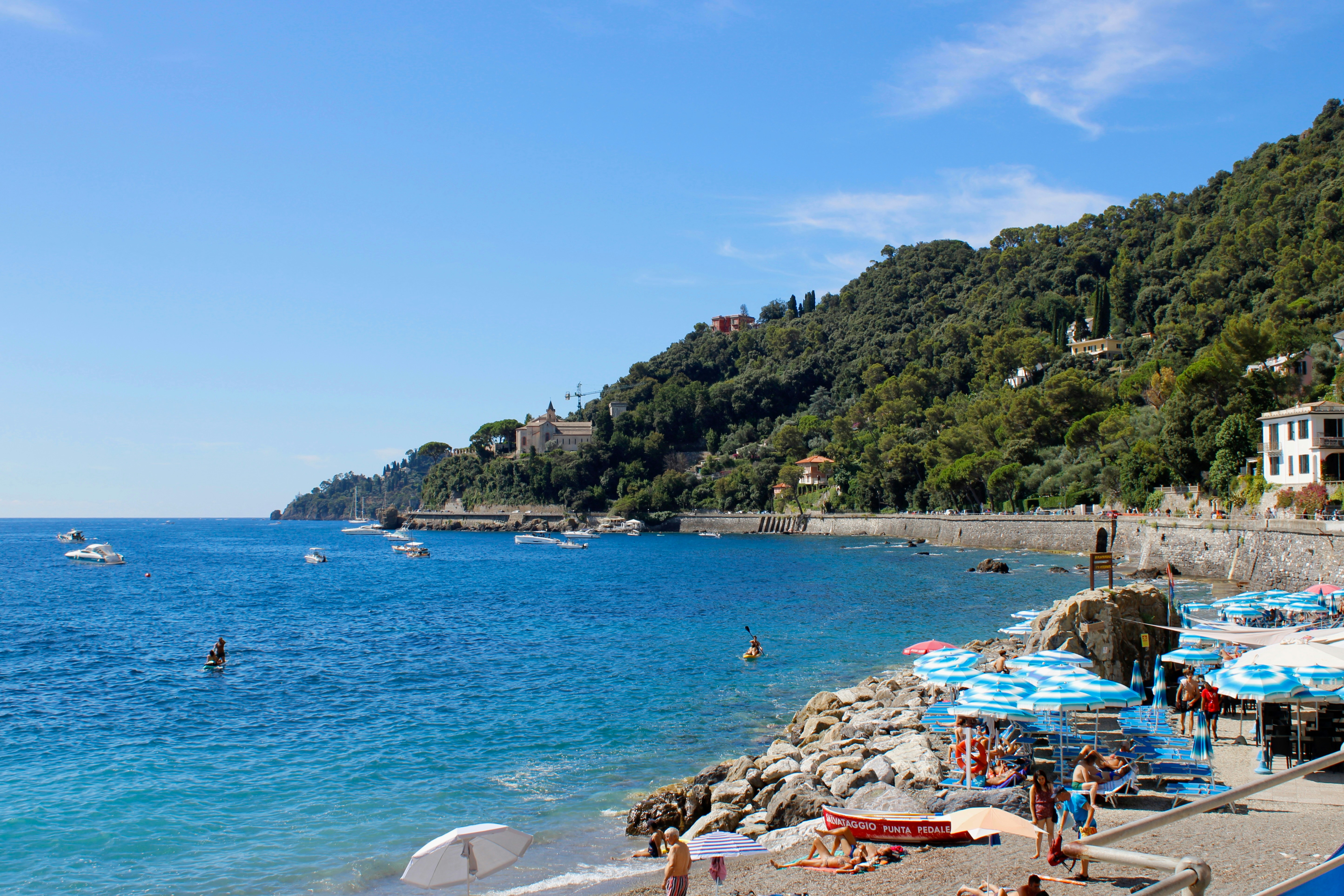 Beachgoers enjoy a scenic view of the beautiful coast.