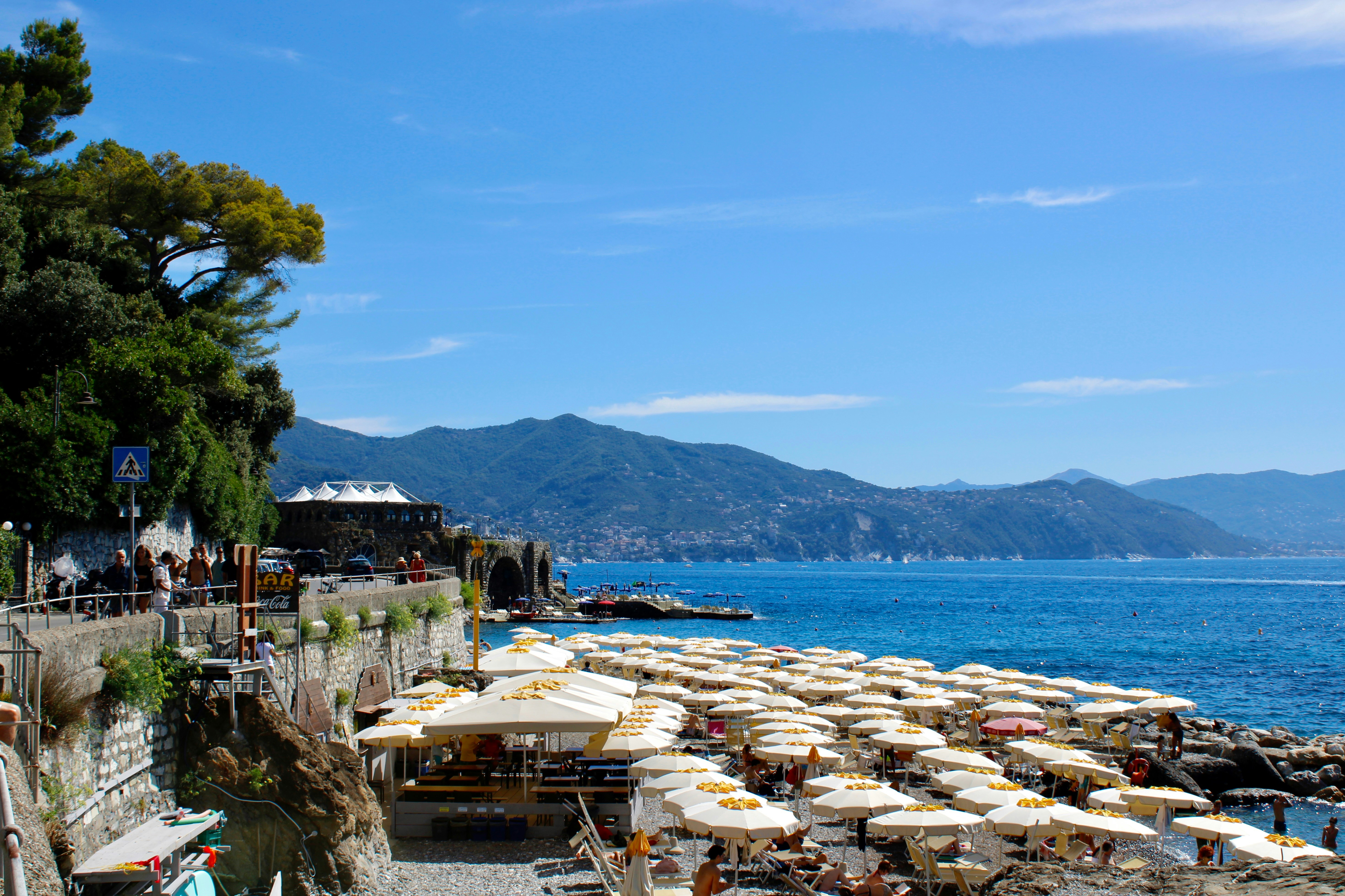A beach with umbrellas overlooks the sea.